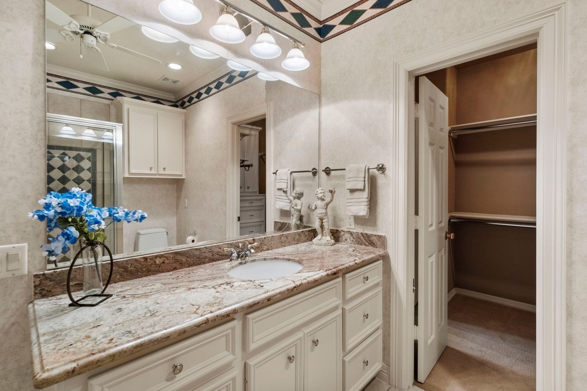 7 Silverloch Court, Sugar Land, TX 77479 Each bedroom has an ensuite bath featuring a granite countertop, ample storage, and a walk-in closet. All closets throughout the home have automatic lighting on/off switch.