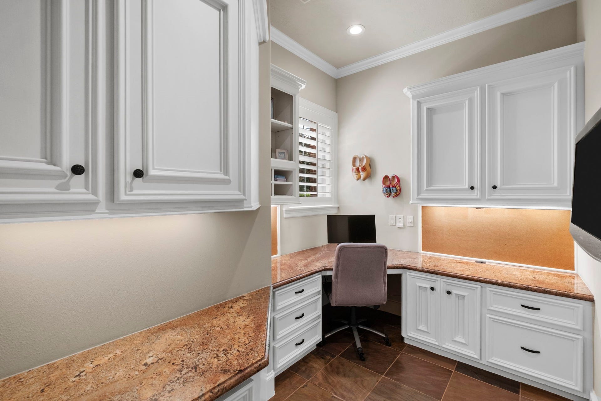 7 Silverloch Court, Sugar Land, TX 77479 2nd home office with custom white cabinetry, granite countertops, and ample storage, perfect for productivity and organization.