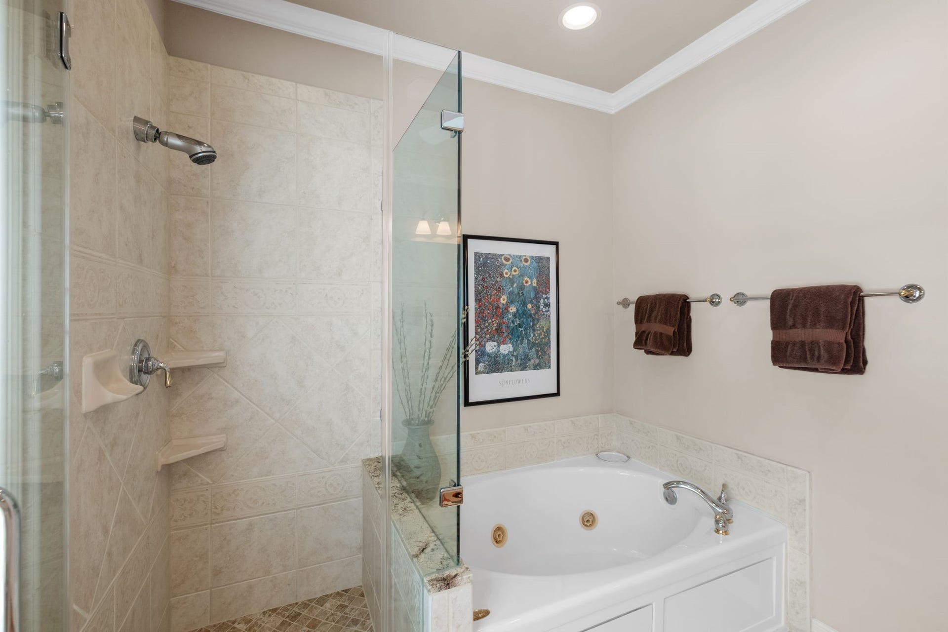7 Silverloch Court, Sugar Land, TX 77479 Elegant bathroom featuring a luxurious jetted tub and a spacious walk-in shower with stylish tilework.