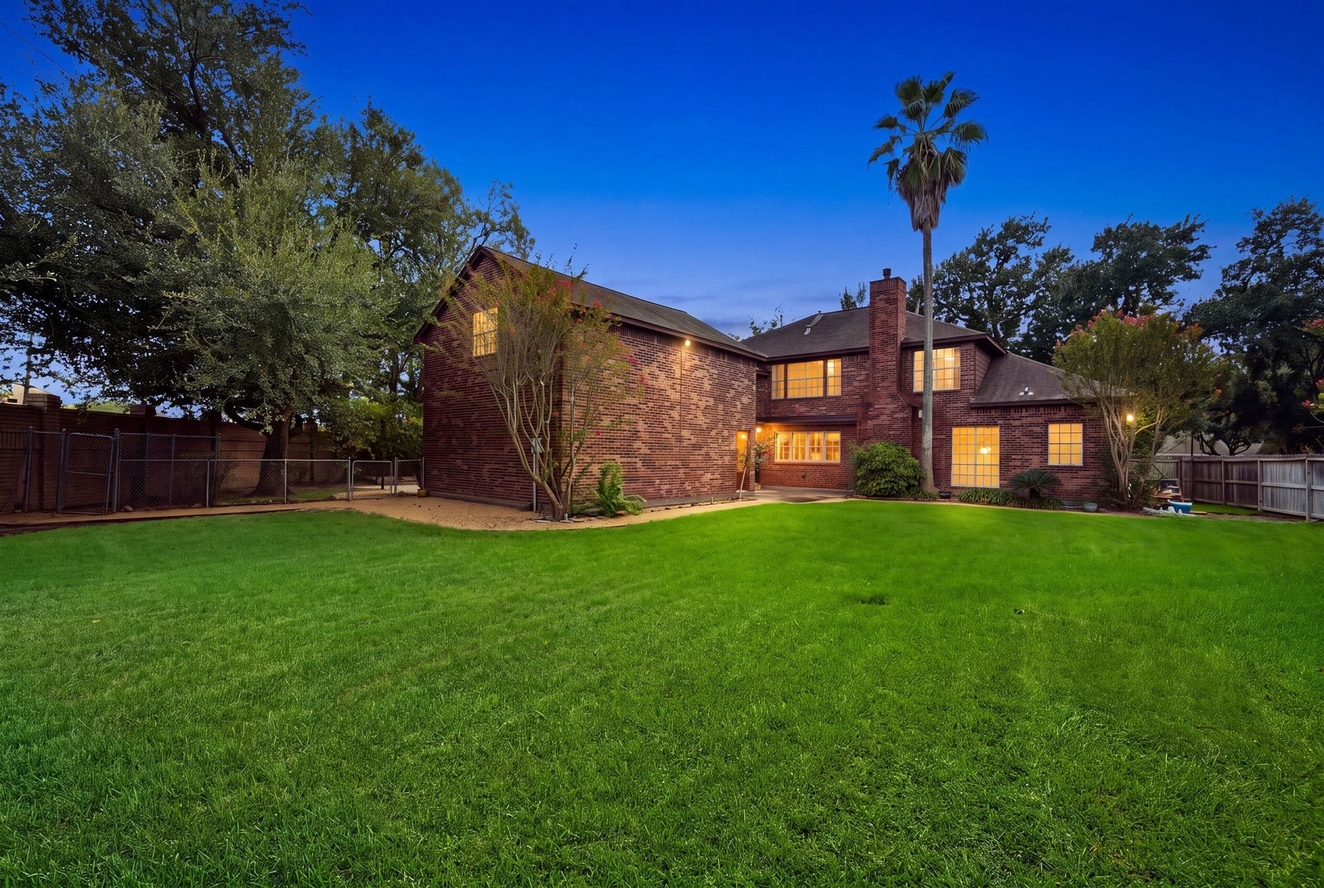 Spacious brick home with a large, lush backyard, surrounded by mature trees. Lot over 14,000sf!