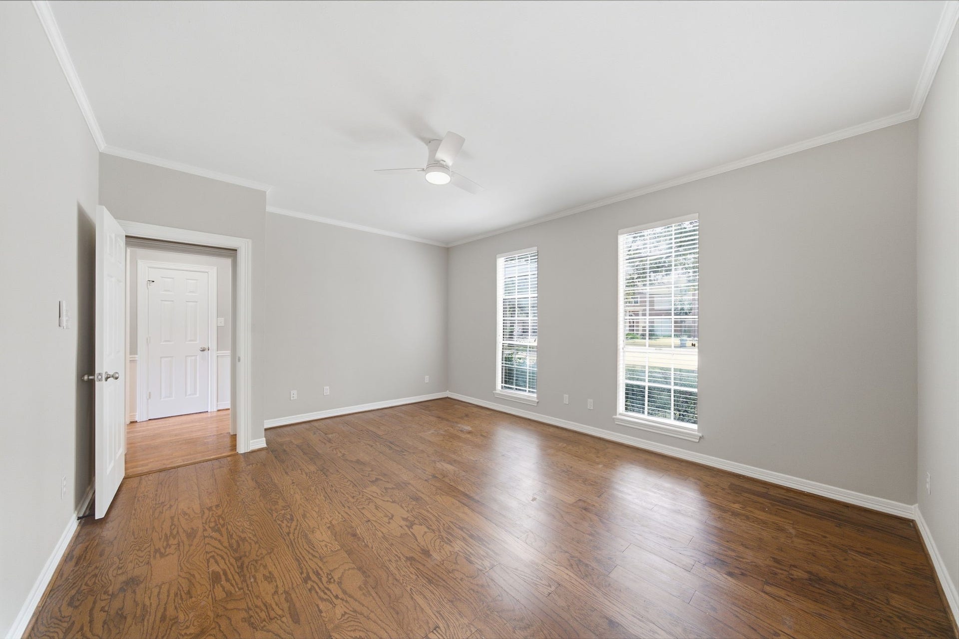 Generous proportions give the primary bedroom plenty of room to create a relaxing retreat with separate sleeping and sitting areas. The suite connects to an impressive remodeled bath and two walk-in closets, creating a truly private owner's retreat.