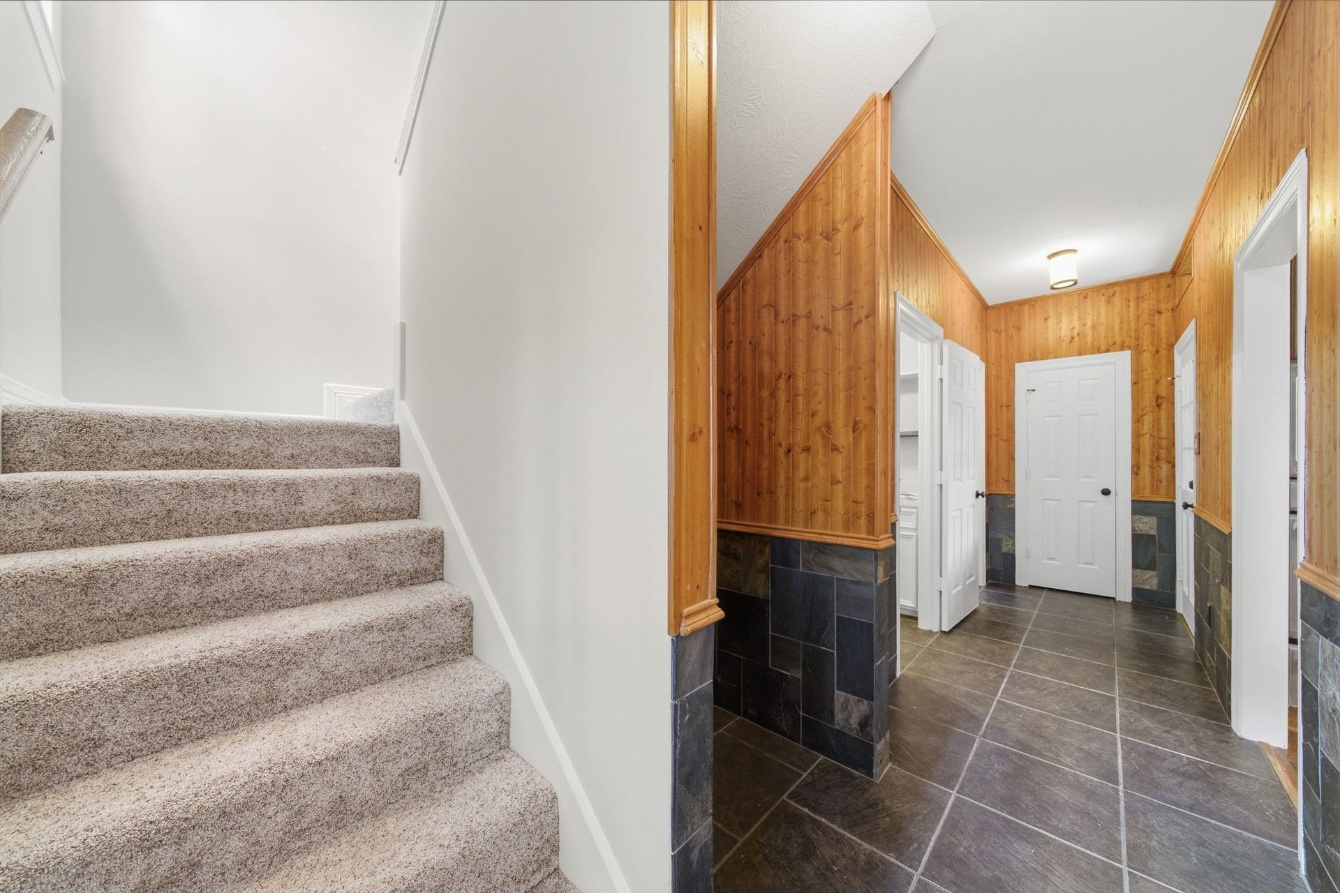 Second set of stairs tucked-away location keeps it discreet while still being convenient for guests and everyday use.