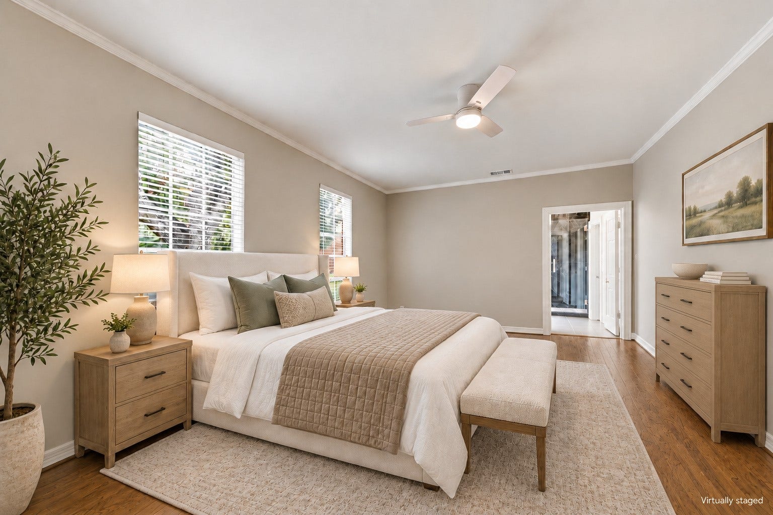 Multiple windows bring in beautiful natural light and views of the home's established surroundings. Virtually staged.