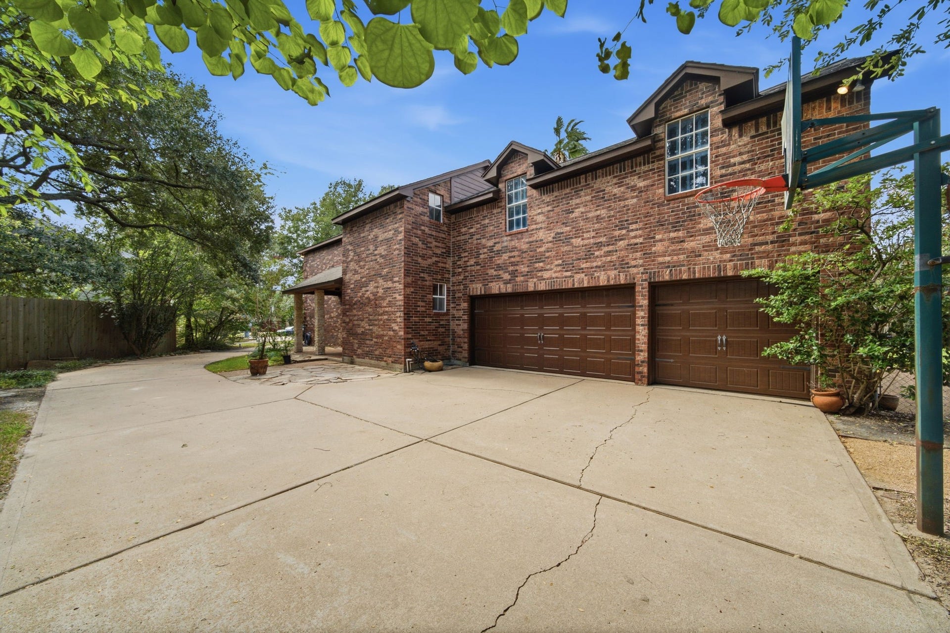 An impressive oversized three-car garage provides exceptional space for vehicles, storage, recreational gear, and more. Side yard and driveway presents so much space for cars and play.