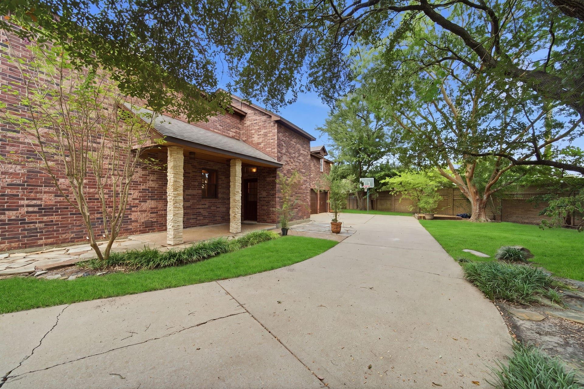 Side yard and entrance creates more private space for gardening and play.