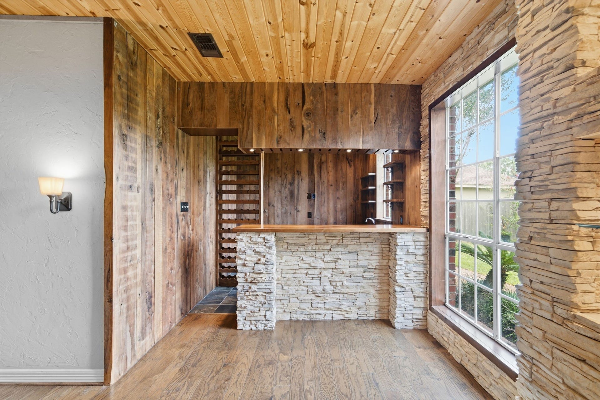 Entertaining gets its own dedicated destination with a built-in wet bar tucked seamlessly into the home's living spaces. Featuring wine storage, sink, wine fridge and TV outlet.