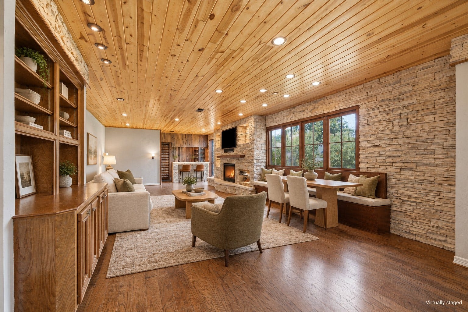 Virtually staged to show the living, dining and bar.