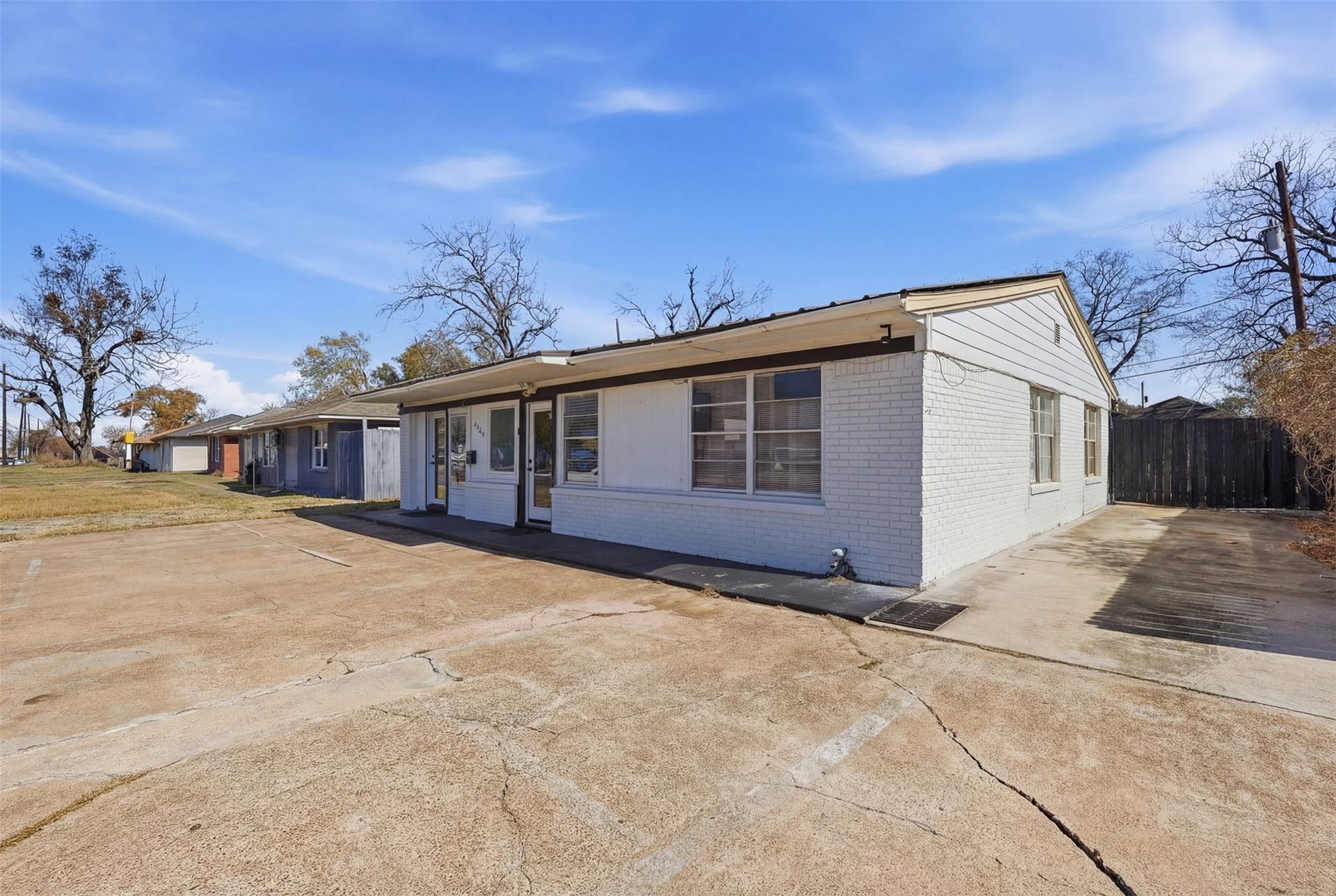 2205 Strawberry Road, Pasadena, TX 77502 Side exterior view featuring additional side parking and convenient access for customers, clients, or residential use.