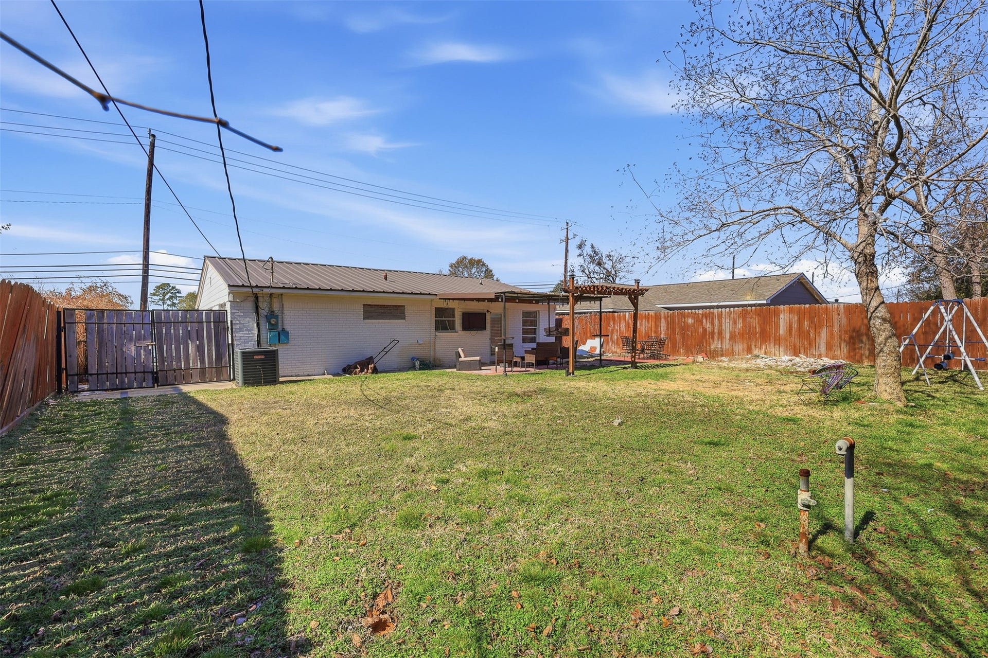 2205 Strawberry Road, Pasadena, TX 77502 Another view of the backyard and access on the left side.