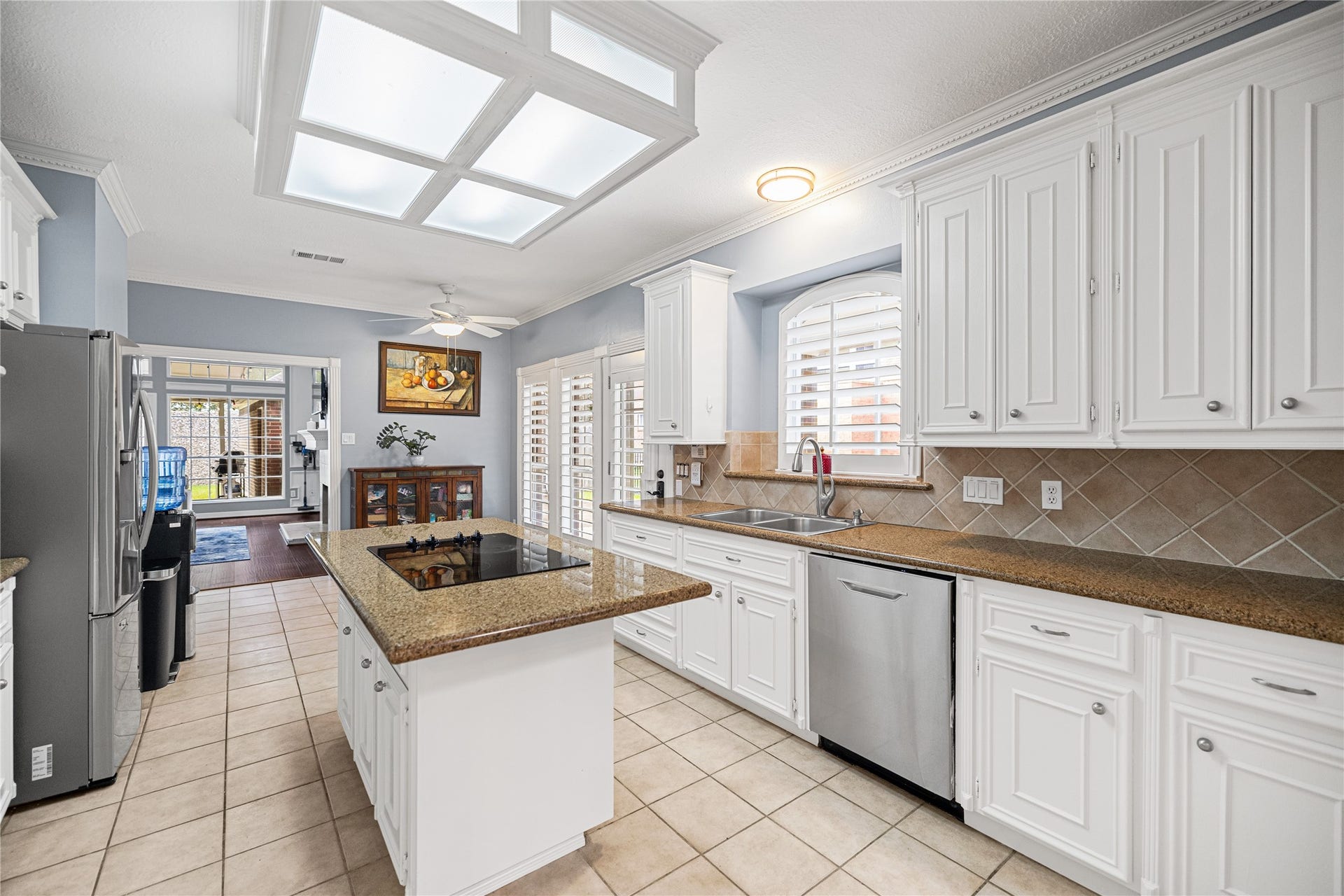 Functional kitchen layout with abundant cabinet storage, generous counter space, and a convenient center island for meal preparation.