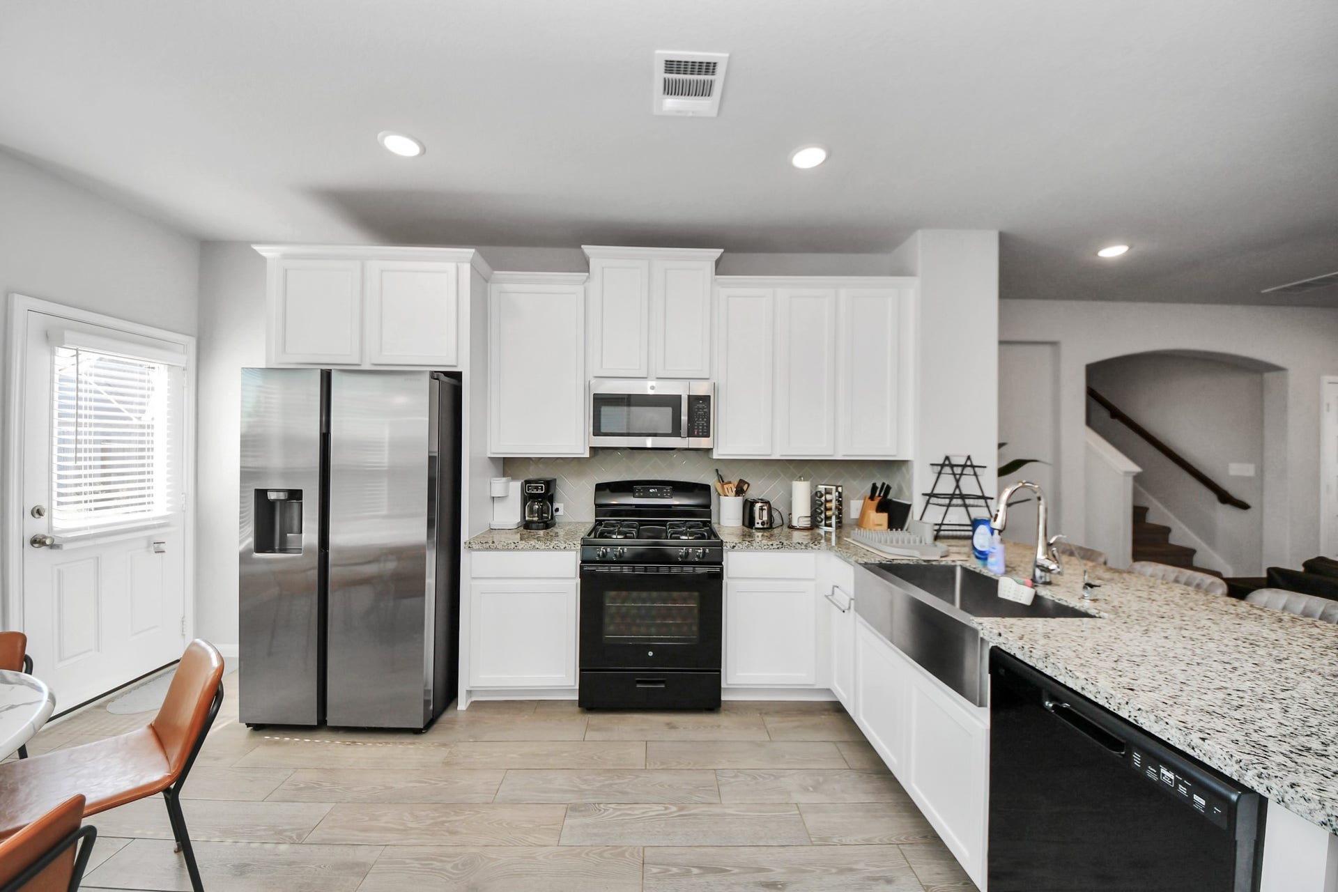 24319 Wild Bramble Lane, Katy, TX 77493 White kitchen with large farmhouse style sink.
