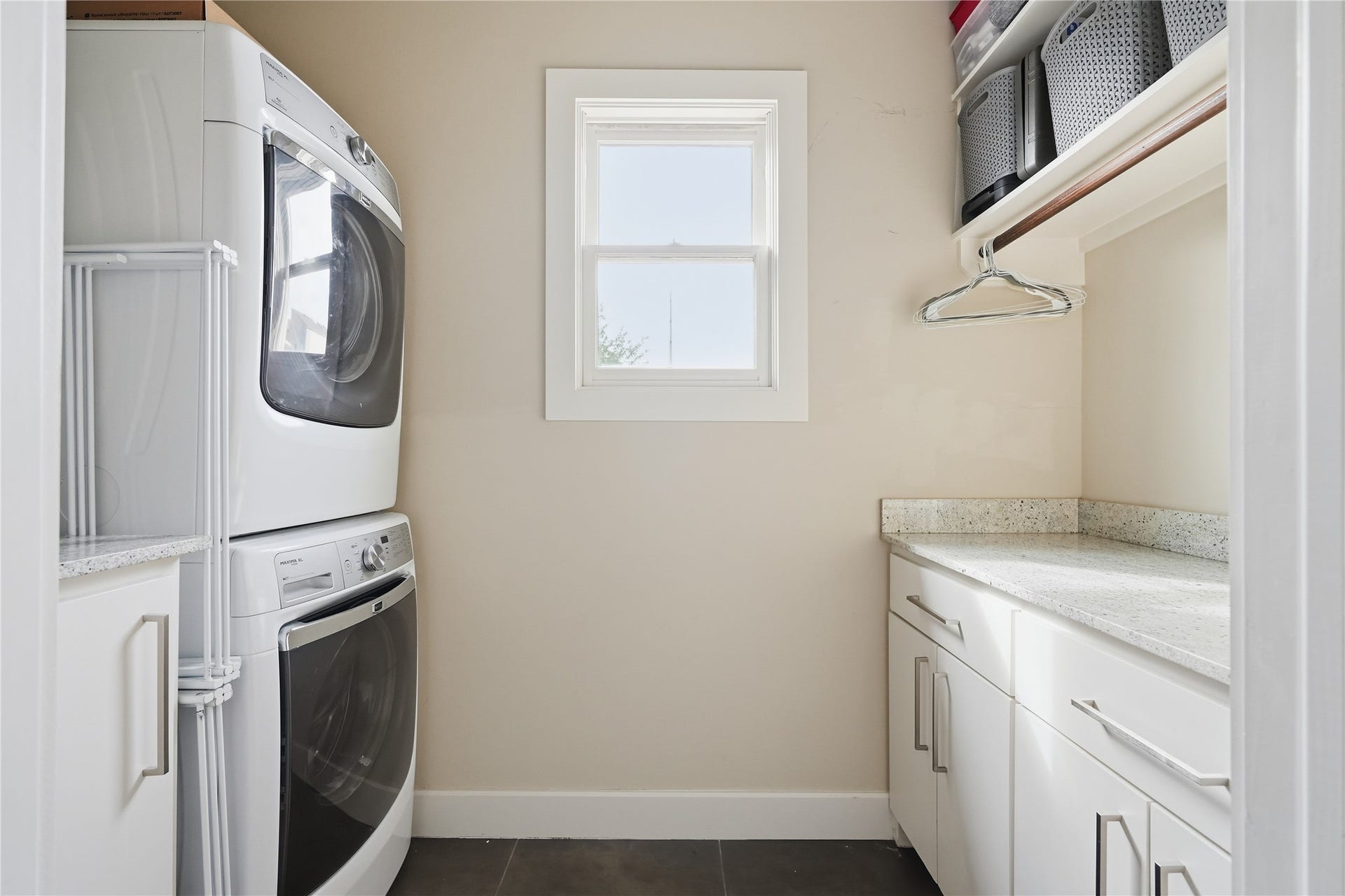 813 Ashland Street, Houston, TX 77007 Upstairs laundry room offers ample storage, workspace for folding, and convenient access to the home's bedrooms.