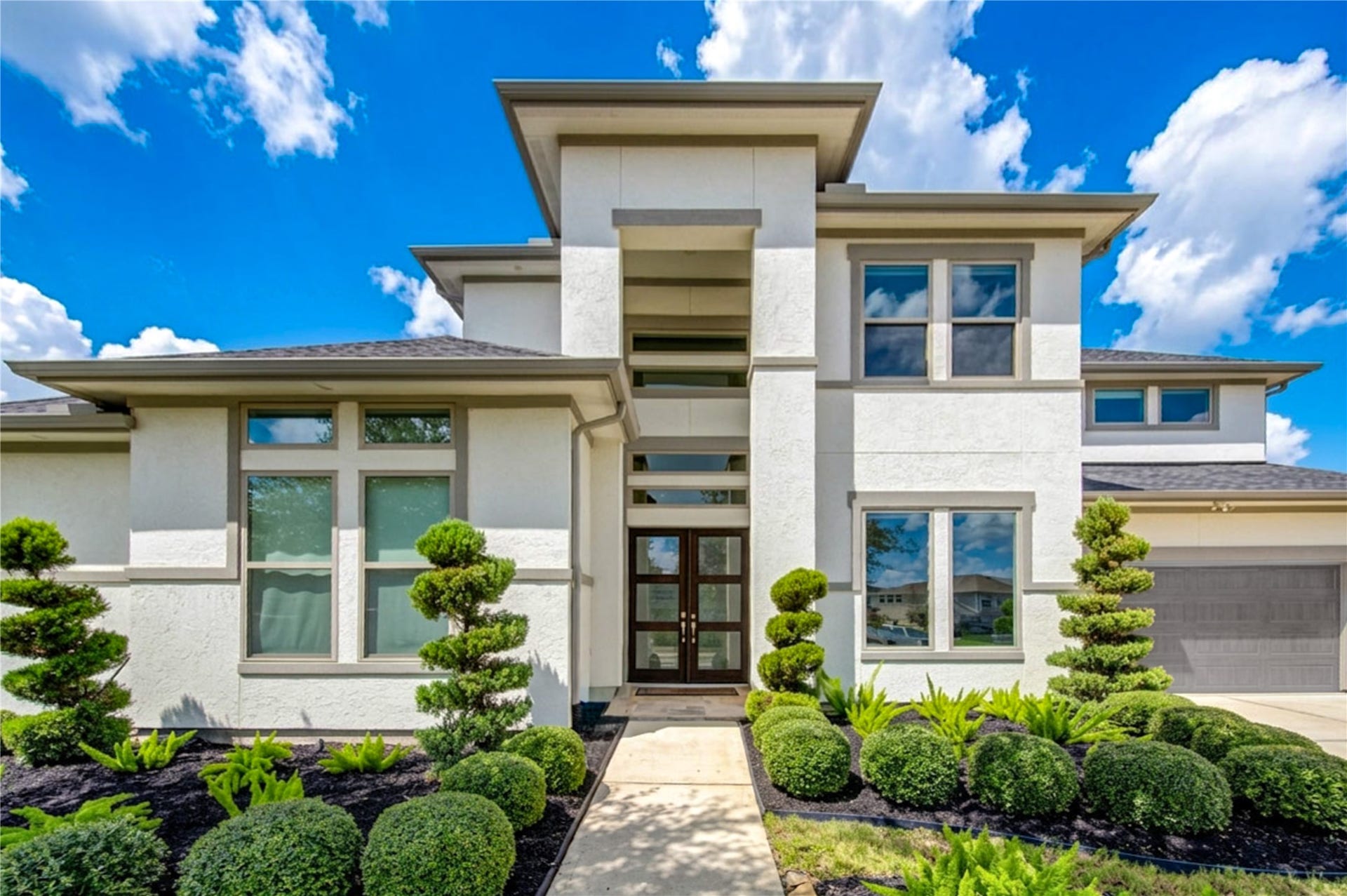 2803 Enriched Enclave Court, Richmond, TX 77406 Spectacular Contemporary/Modern home featuring a whole-home generator, water softener, HVAC-conditioned enclosed patio, outdoor kitchen, sparkling pool and spa, and an exceptional oversized lot.