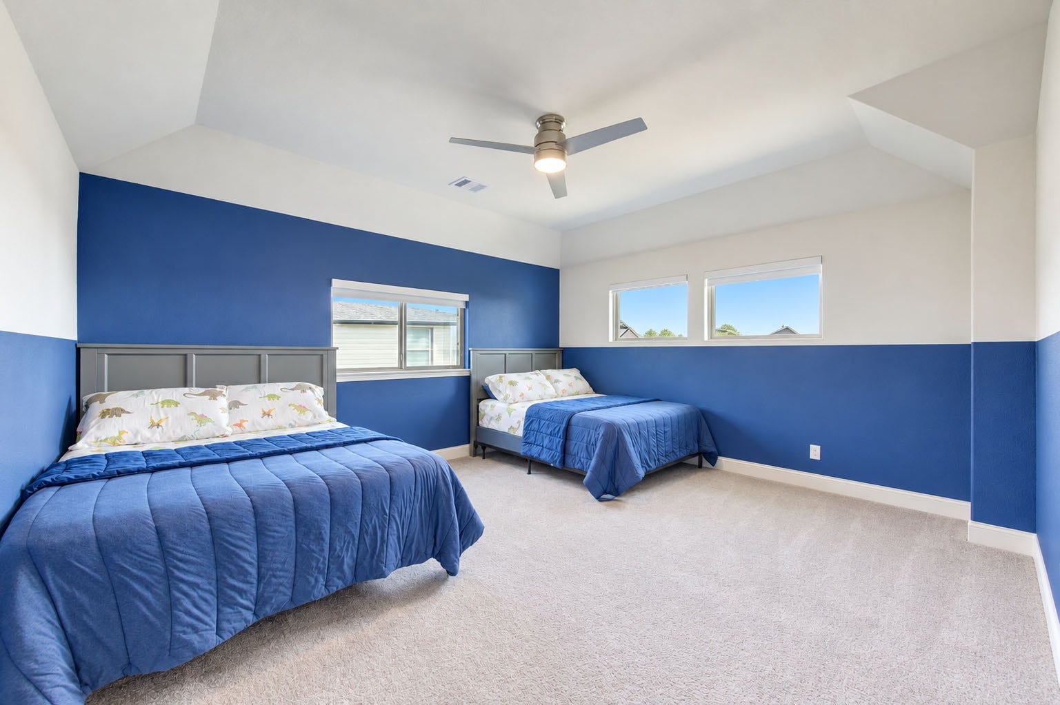 2803 Enriched Enclave Court, Richmond, TX 77406 Spacious upstairs bedroom #3 with vaulted ceilings, abundant natural light, and plenty of room for multiple beds.