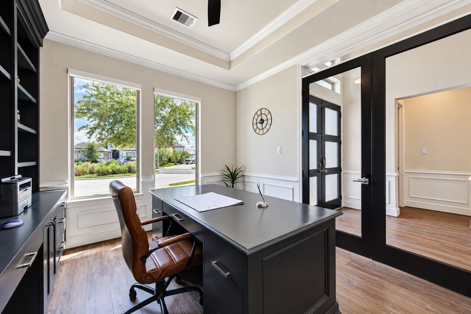 2803 Enriched Enclave Court, Richmond, TX 77406 Sophisticated home office featuring custom built-ins, abundant natural light, and stylish glass French doors.