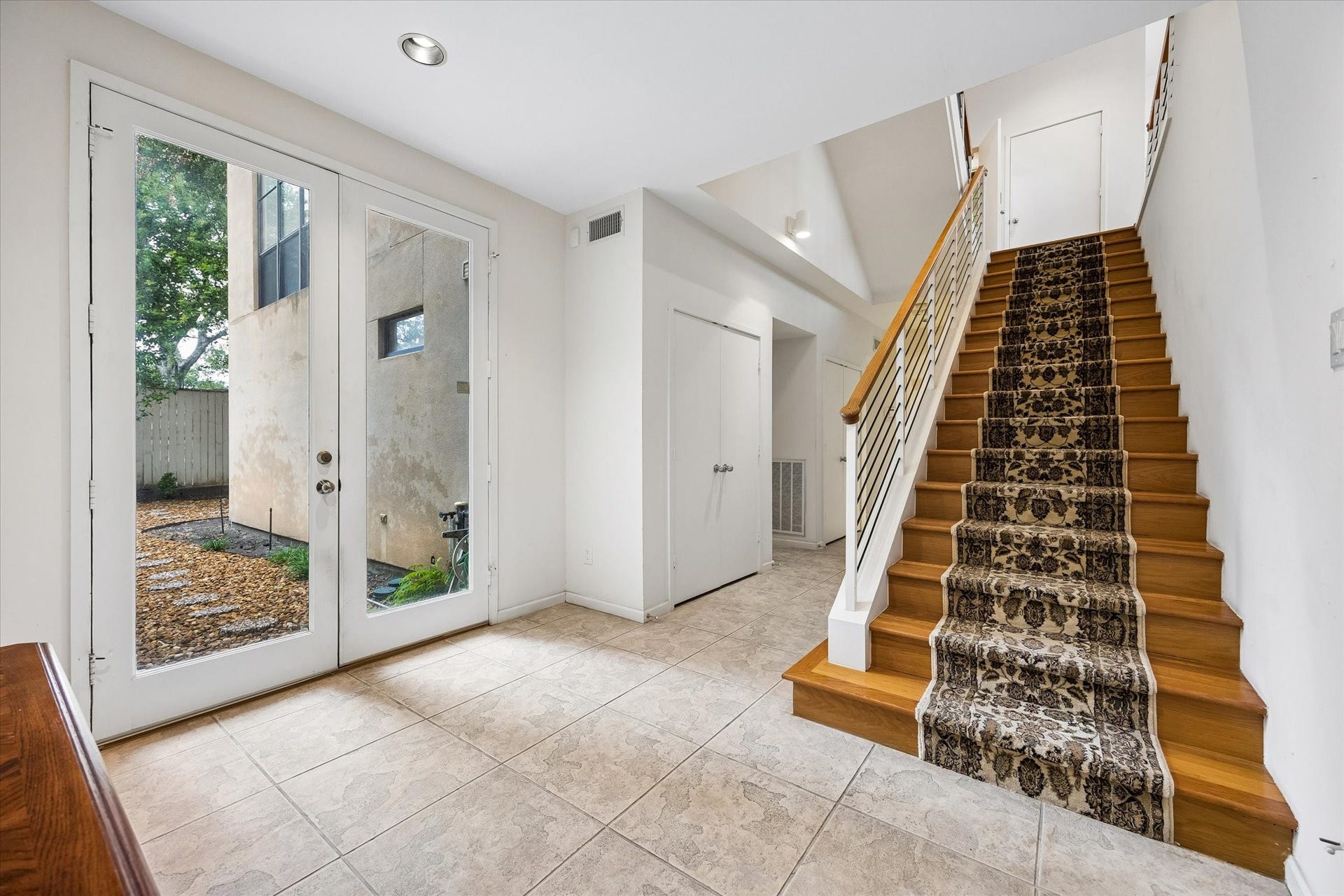 STEP INTO THE GRAND FOYER WHICH LEADS TO A MASSIVE OFFICE OR COULD BE 2 BEDROOMS, THAT HAS 2 FULL COMPLETE BATHS.  BEAUTIFUL FLOOR TO CEILIING DOORS AND WINDOWS THROUGHOUT THIS LOVELY HOME.