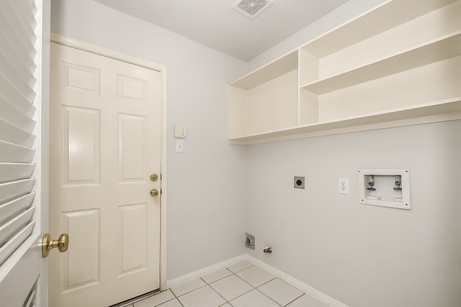 1802 Barbara Court, Deer Park, TX 77536 spacious laundry room with shelves