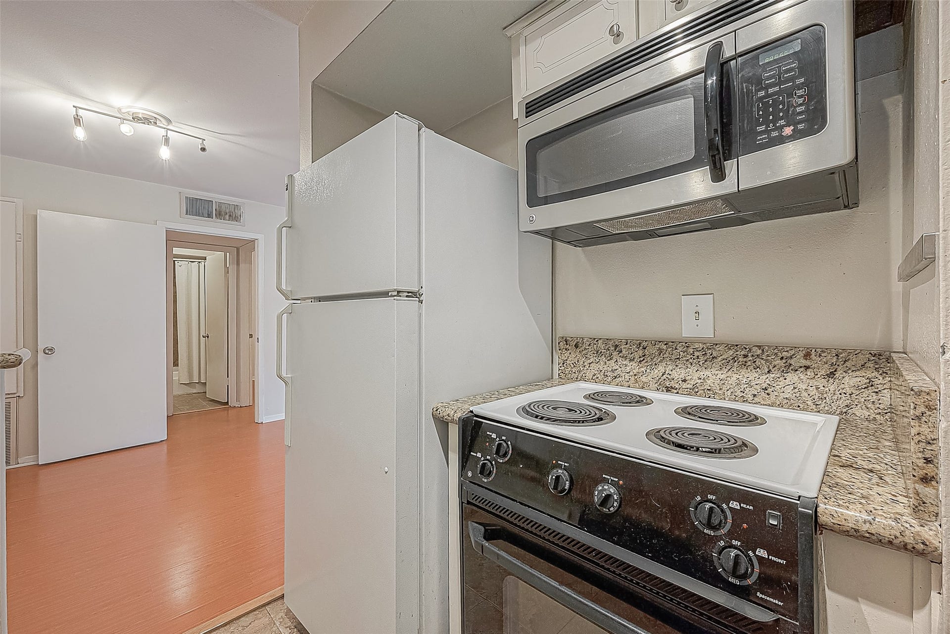 3131 Cummins Street, #54, Houston, TX 77027 The kitchen comes equipped with the appliances you needincluding a refrigerator, electric range & built-in microwave. Best of all, the refrigerator stays with the condo, so thats one less thing to worry about when moving in!