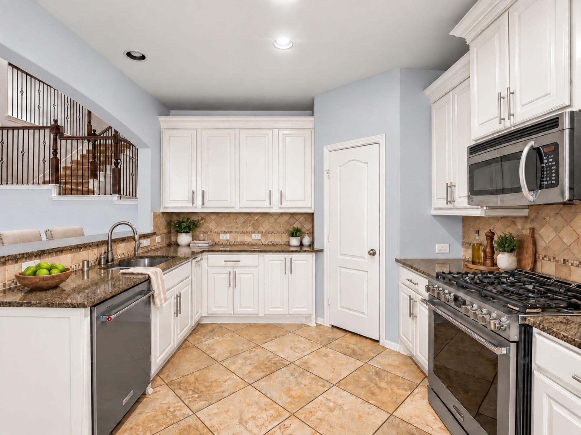 The kitchen features recessed lighting