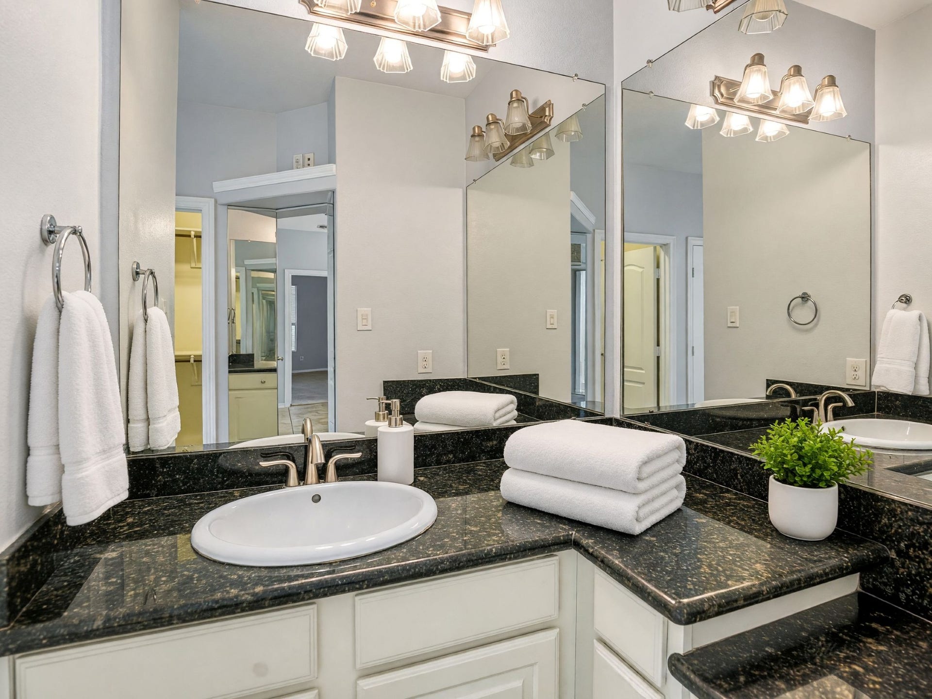 Primary bath -mirrors get the angles! Vanity to sit at to get ready for the day!