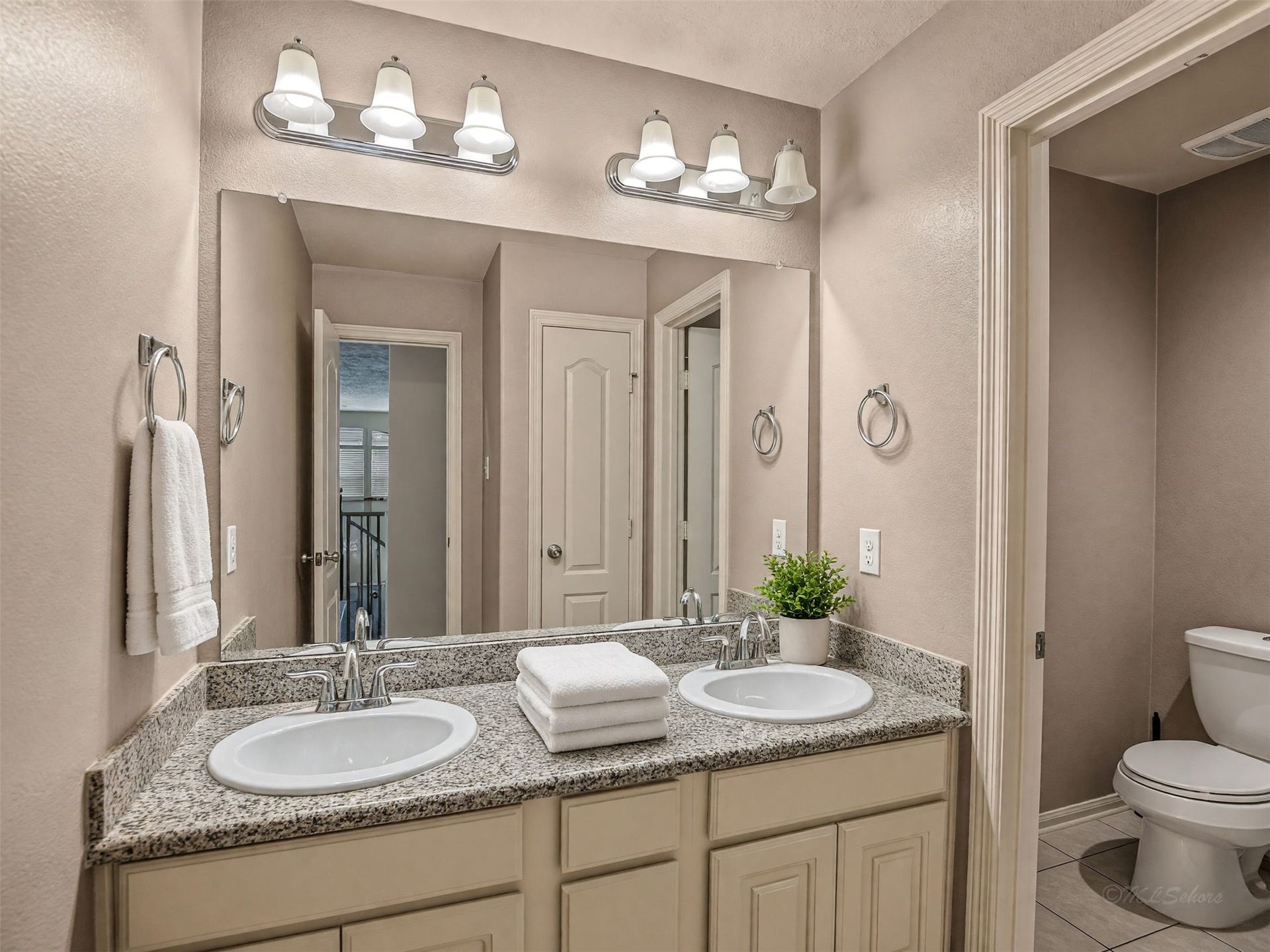 Upstairs bathroom with double sinks and separate bath/shower and toilet. (VS)