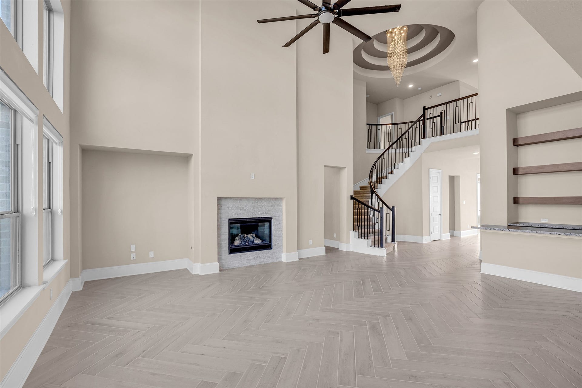 2718 Newbury Island Lane, Katy, TX 77493 A staircase in the family room leads to the second floor, providing easy access to the upper-level bedrooms and spaces.