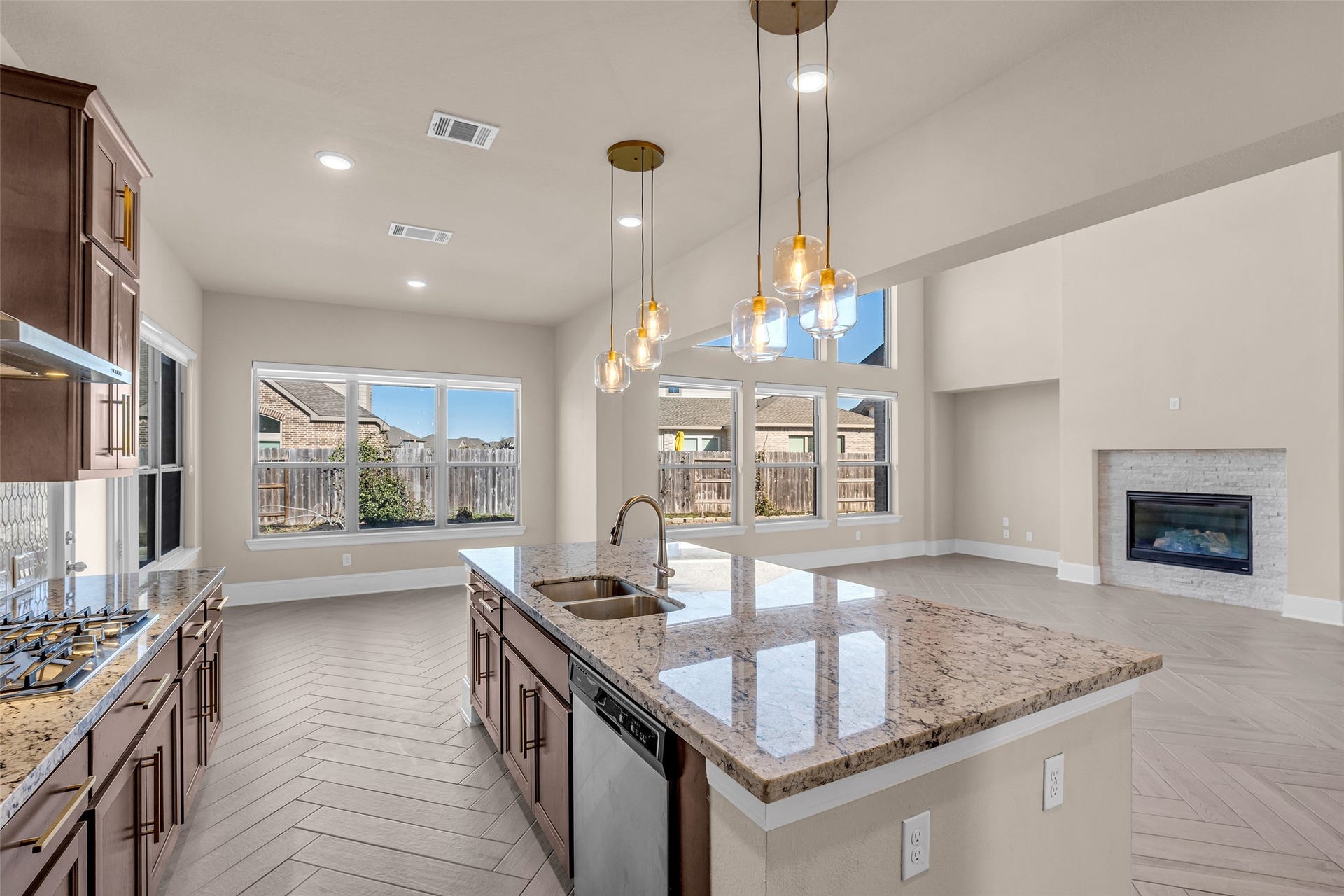 2718 Newbury Island Lane, Katy, TX 77493 Another view from the kitchen shows how the kitchen, breakfast nook, and family room connect in an open layout.