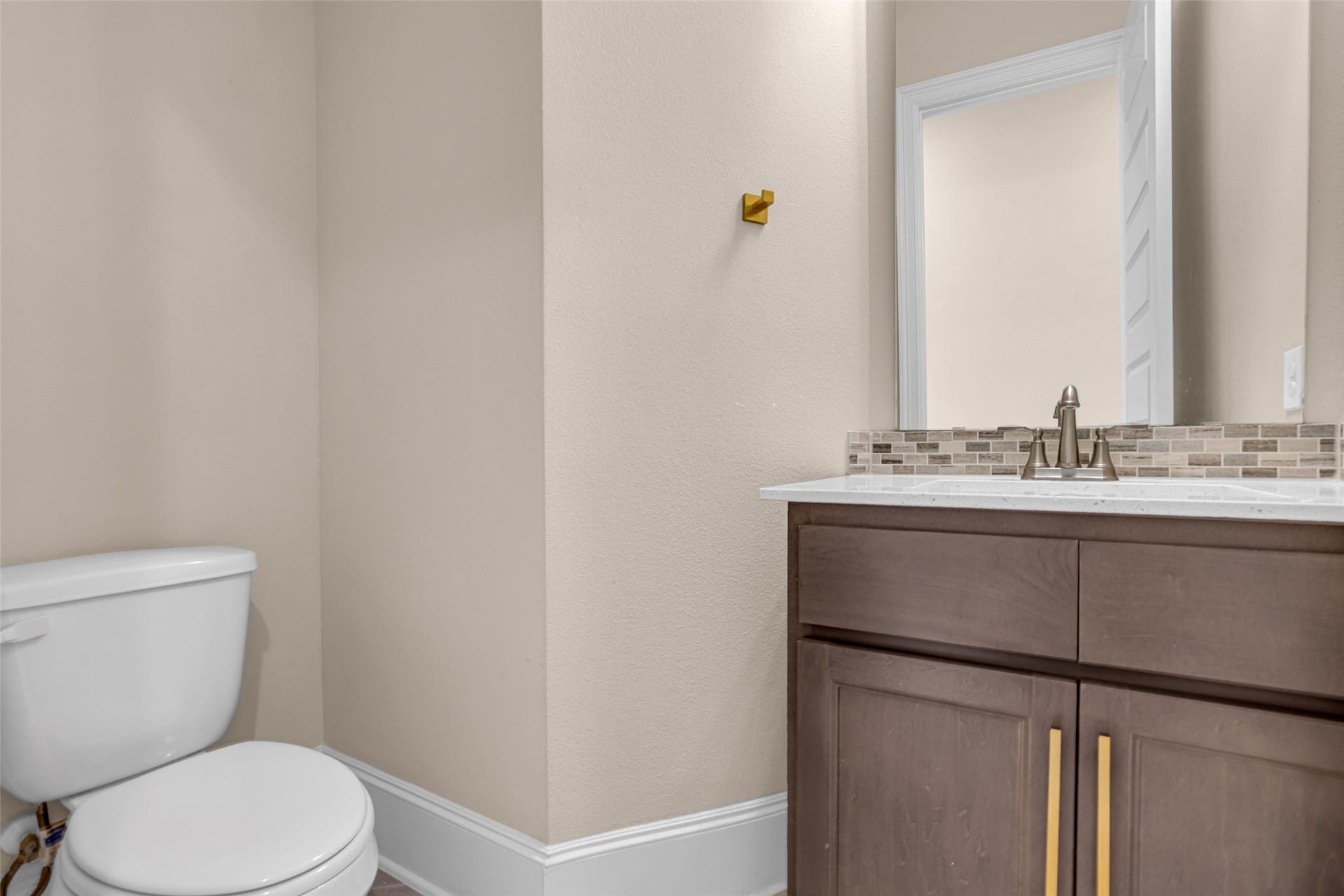 2718 Newbury Island Lane, Katy, TX 77493 The first-floor half bath provides a convenient and functional space for guests.