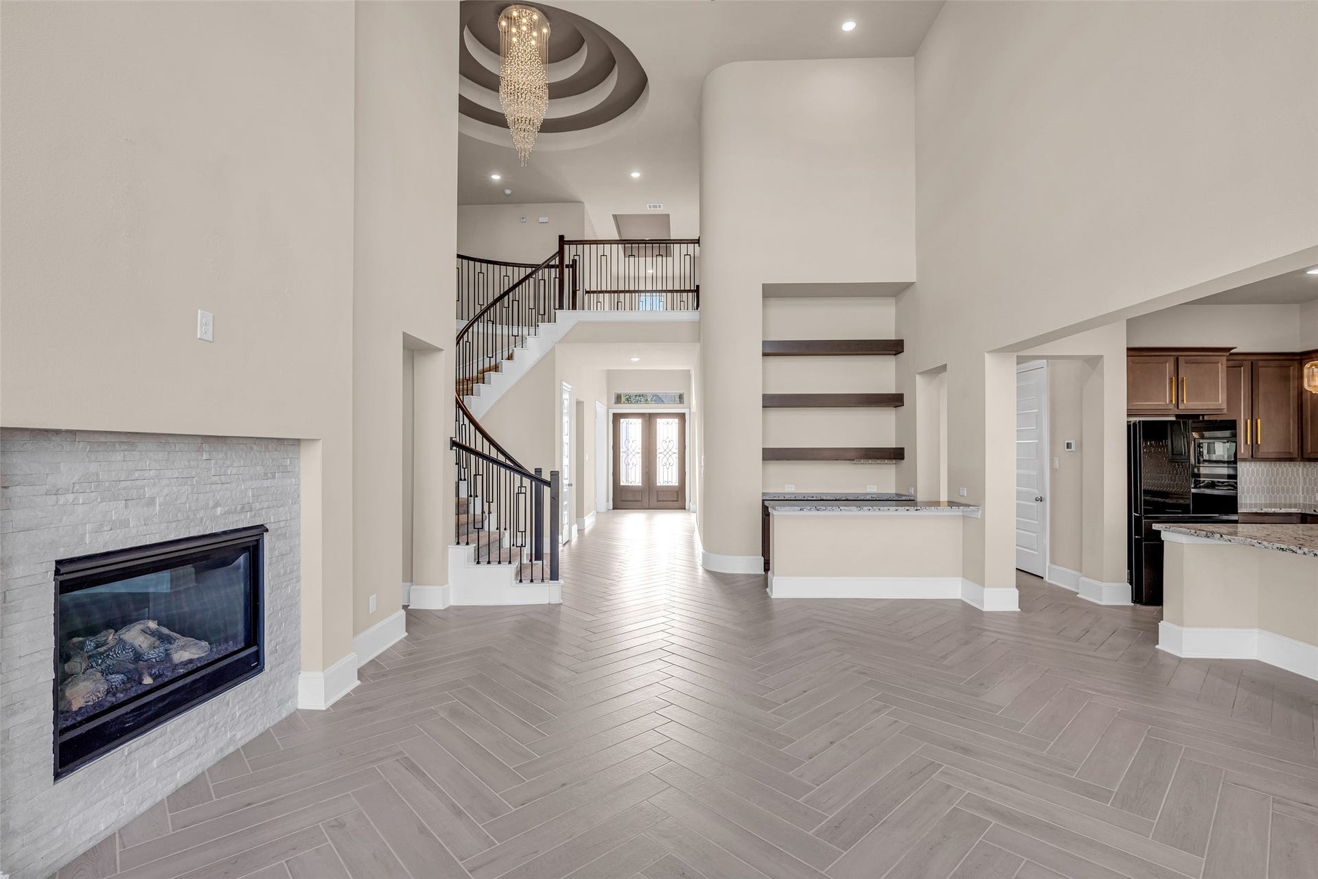 2718 Newbury Island Lane, Katy, TX 77493 The space flows seamlessly into the kitchen and breakfast nook, creating an open and connected layout.
