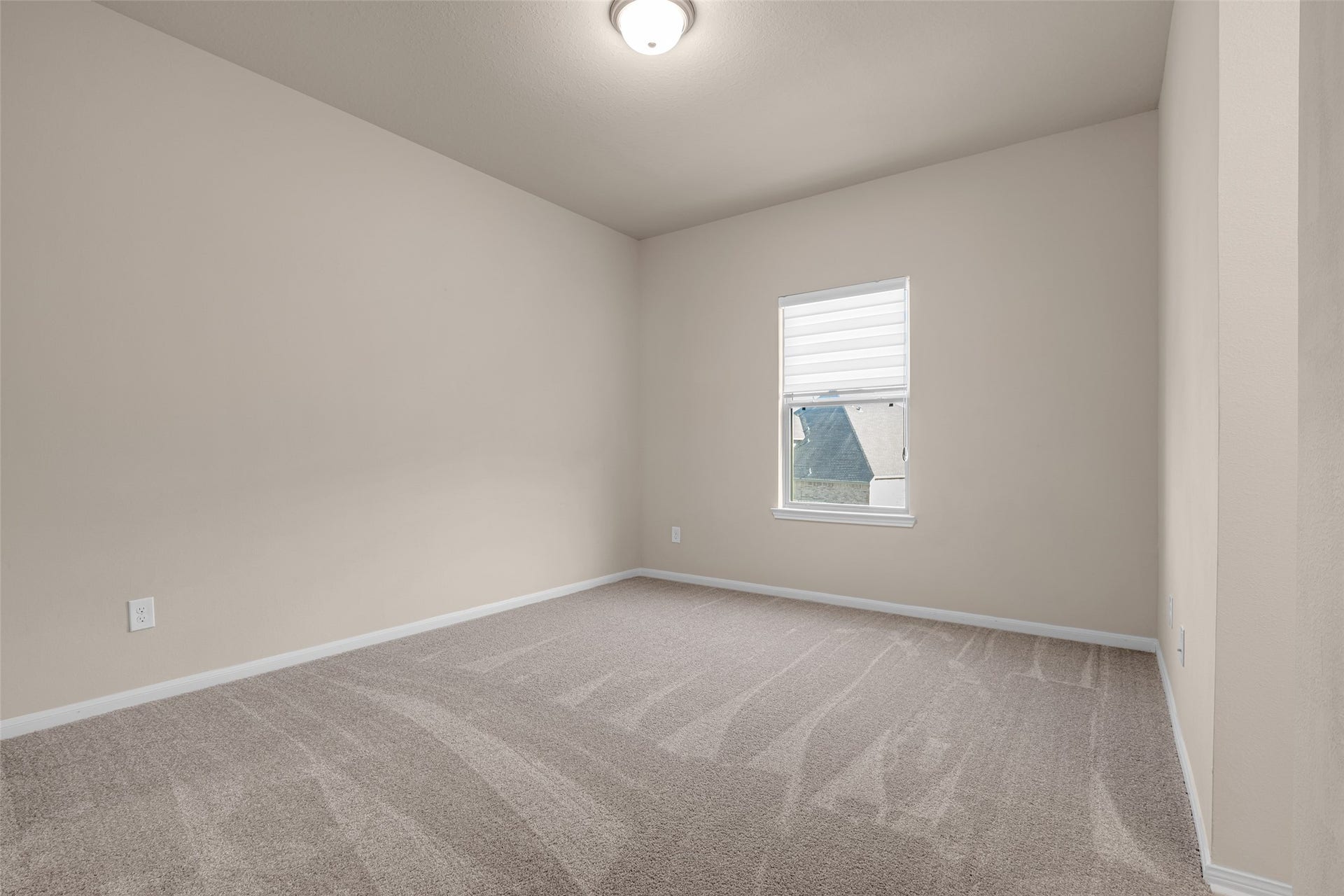 2718 Newbury Island Lane, Katy, TX 77493 This second-floor secondary bedroom mirrors the layout and features of the other bedroom on the same floor.