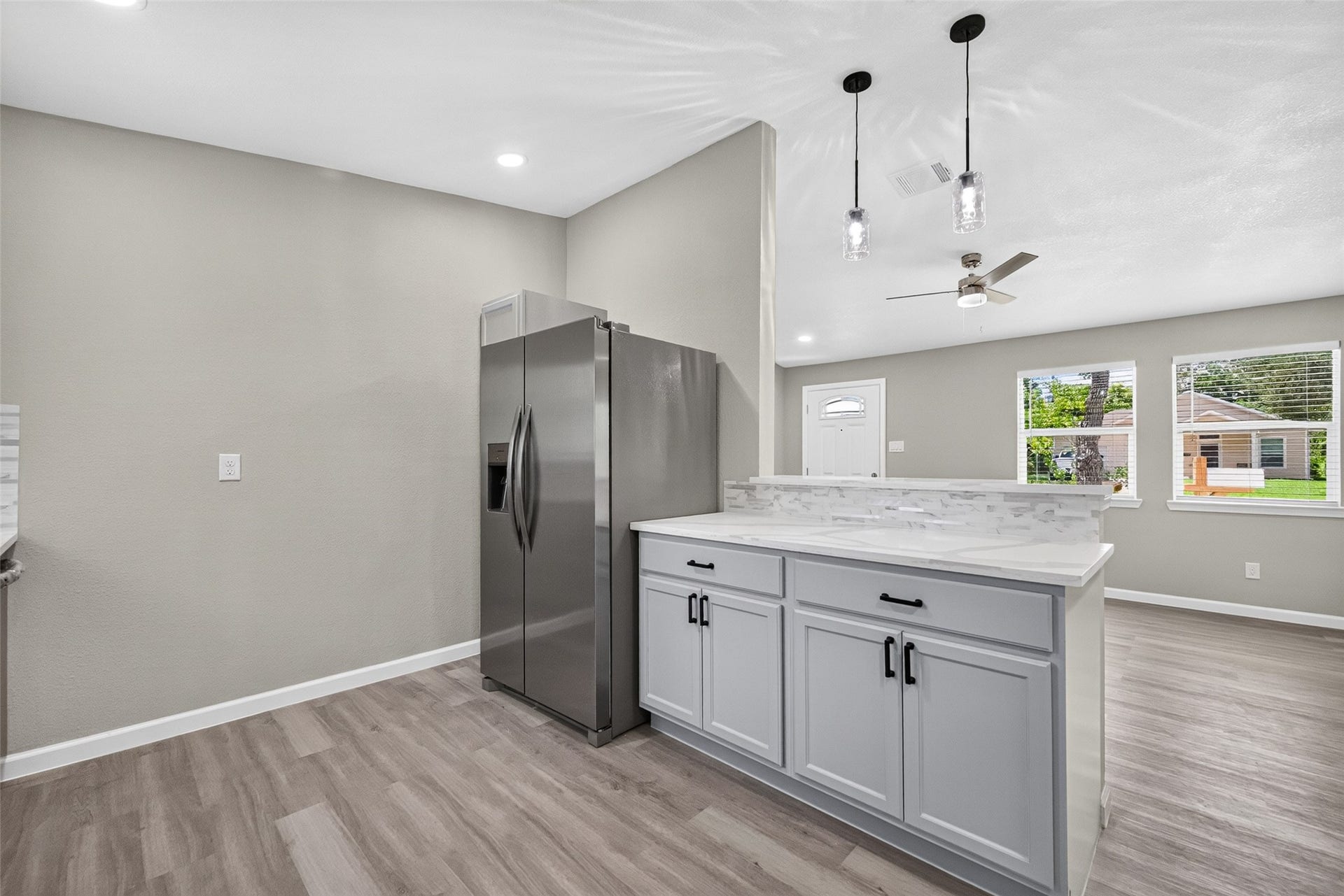 1302 Appomattox Drive, Texas City, TX 77591 Pendant lights above bar top in kitchen