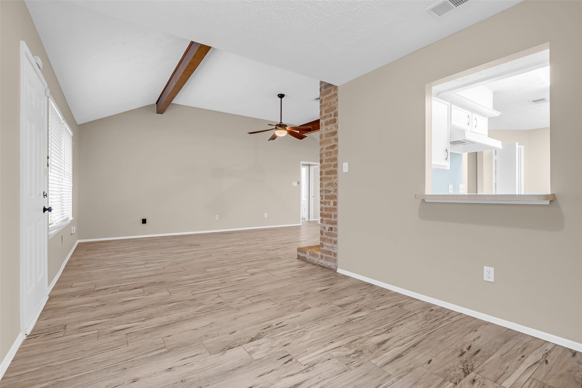 11827 Brook Meadows Lane, Meadows Place, TX 77477 Dining room is open to both the family room and has a convenient pass-through window to the kitchen