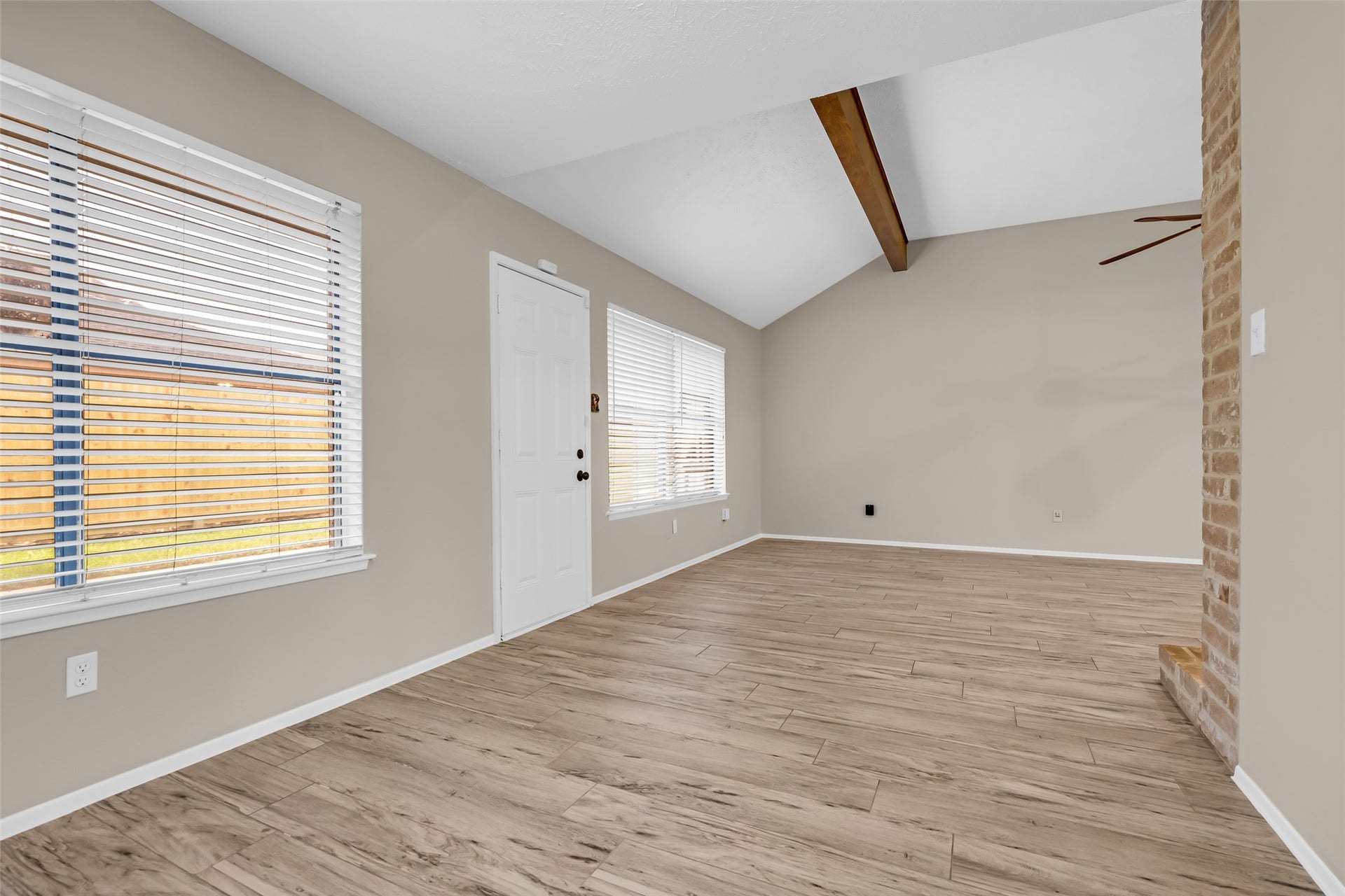 11827 Brook Meadows Lane, Meadows Place, TX 77477 Dining room open to family room with view of the fenced back yard