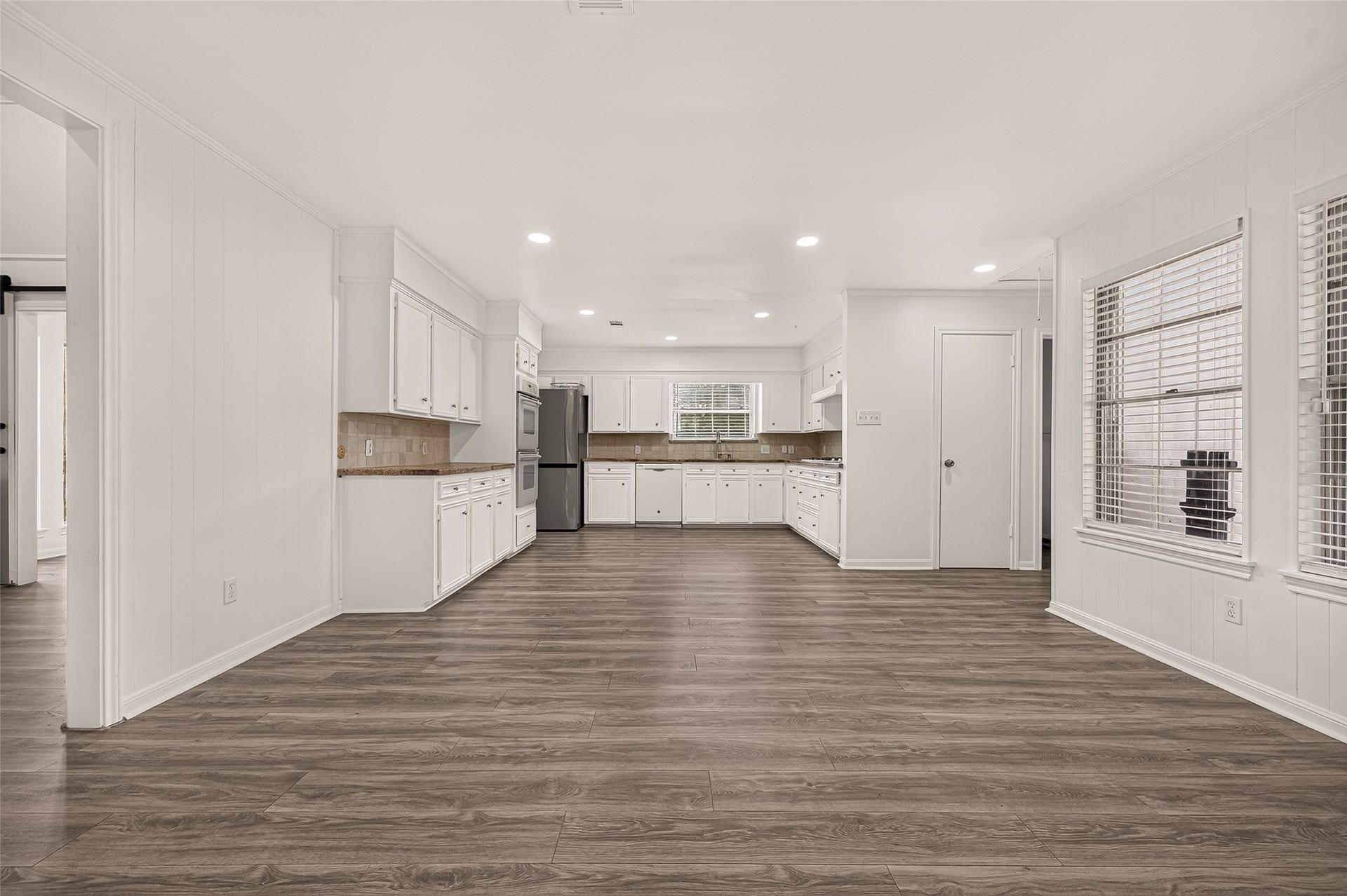 2230 S Fountain Valley Drive, Missouri City, TX 77459 Massive eat-in kitchen features a back door entrance, utility room, and half bathroom.