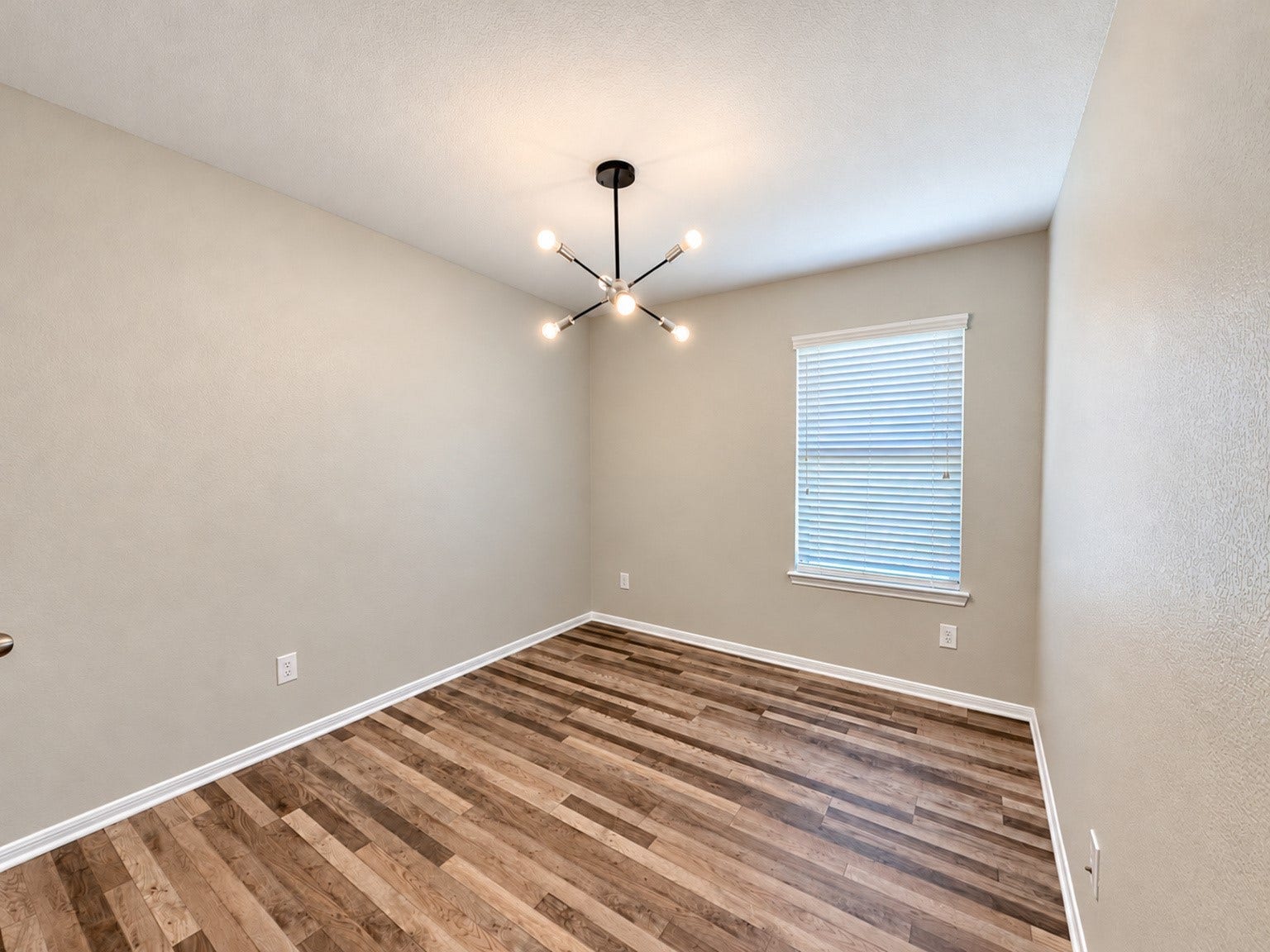29202 Dunns Creek Court, Katy, TX 77494 Secondary bedroom with wood-look flooring, neutral walls, and a window with blinds.