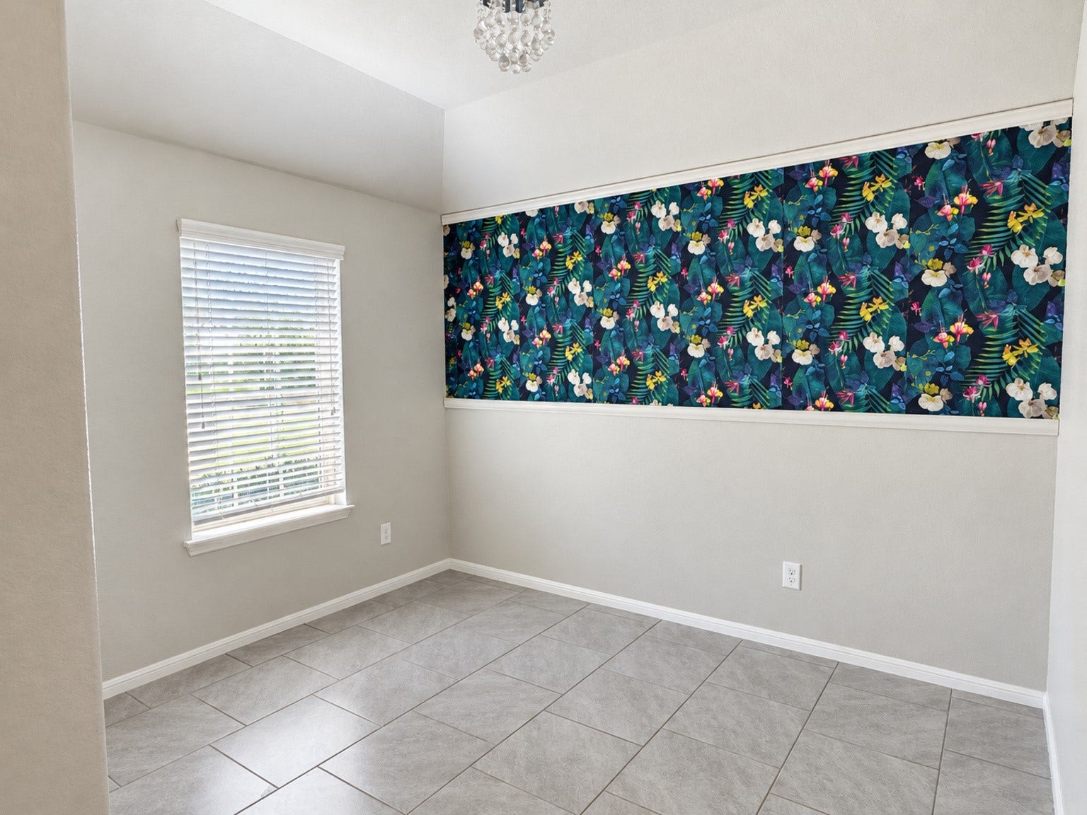 29202 Dunns Creek Court, Katy, TX 77494 Light-filled dining room with tile flooring, a decorative light fixture, and a colorful floral accent wall.
