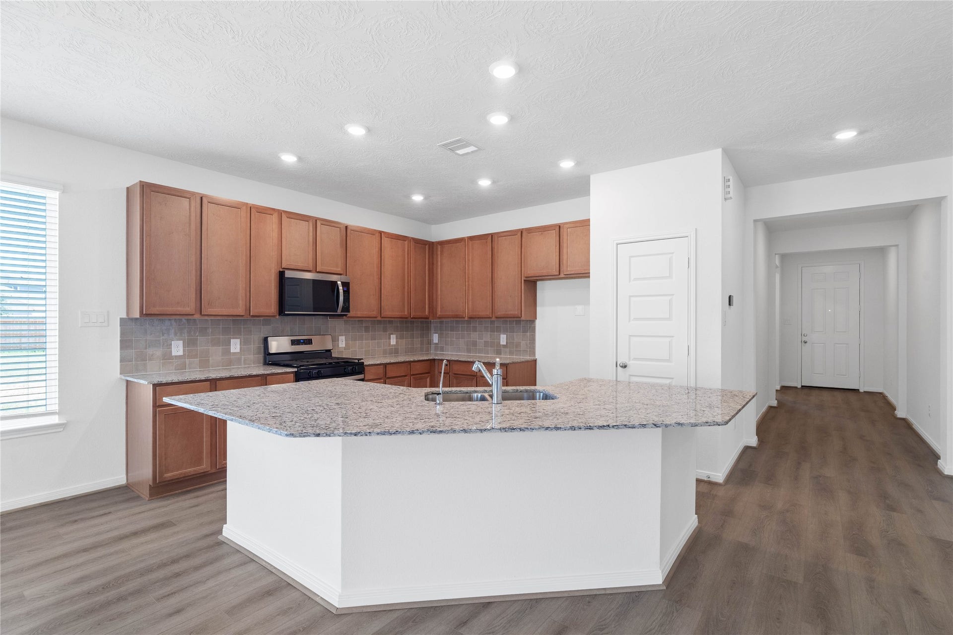 This spacious kitchen has it allample storage, generous counter space, and a layout that truly makes it the heart of the home.