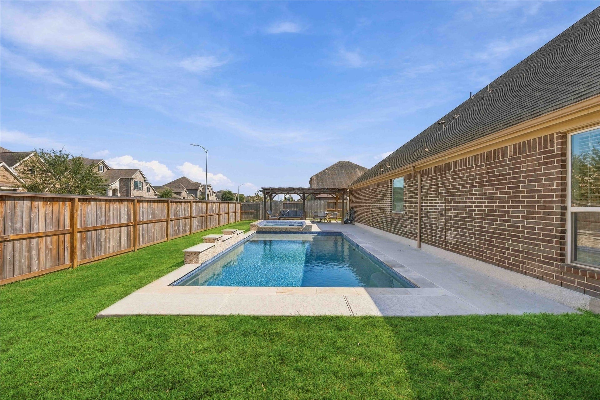 Enjoy your own backyard oasis featuring a beautiful in-ground swimming pool and relaxing hot tub, perfect for cooling off on warm days or unwinding under the stars. This inviting outdoor Retreat is ideal for entertaining guests, hosting summer gatherings, or creating unforgettable moments right at home.