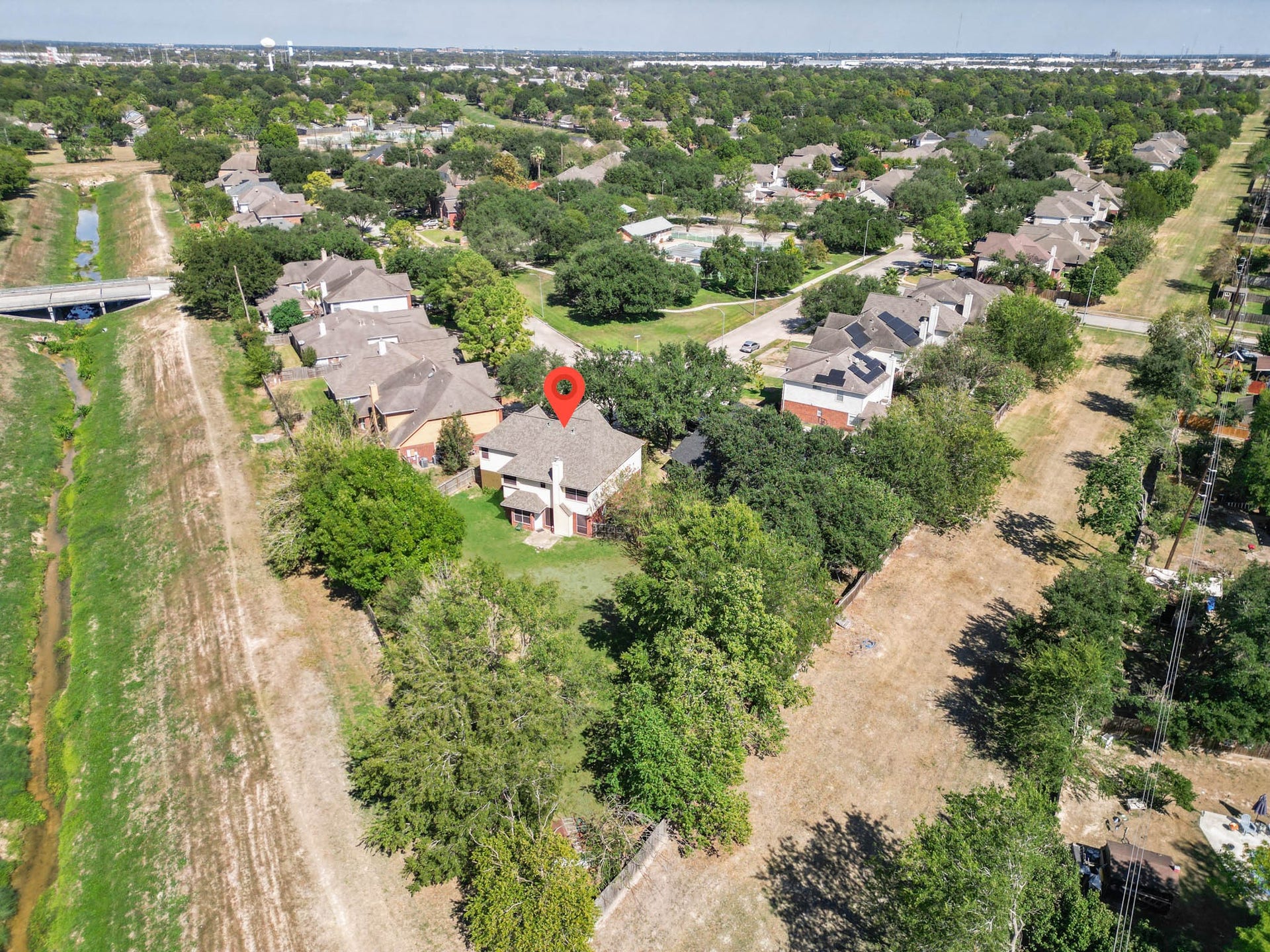 10003 Briarpark Trail Lane, Houston, TX 77064 An elevated look at the surrounding neighborhood showcases the established community, mature trees and spacious residential setting.