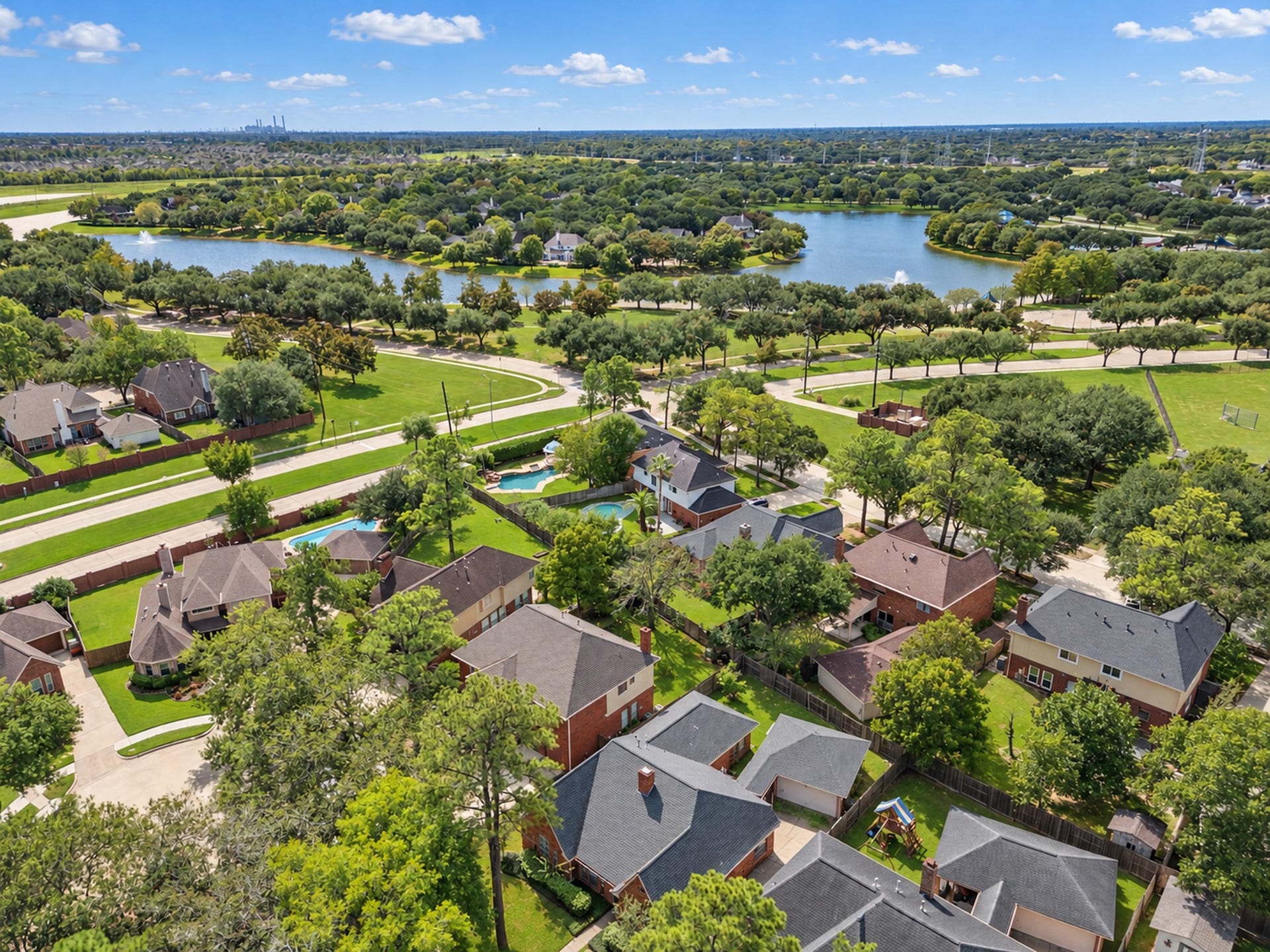 2922 Calendar Lake Drive, Missouri City, TX 77459 Fantastic view of the subdivision and neighborhood! The house is walking distance to the First Colony Aquatic Center which features an Olympic sized pool and the resort style pool area with lazy river, water slides, and splash pad!!