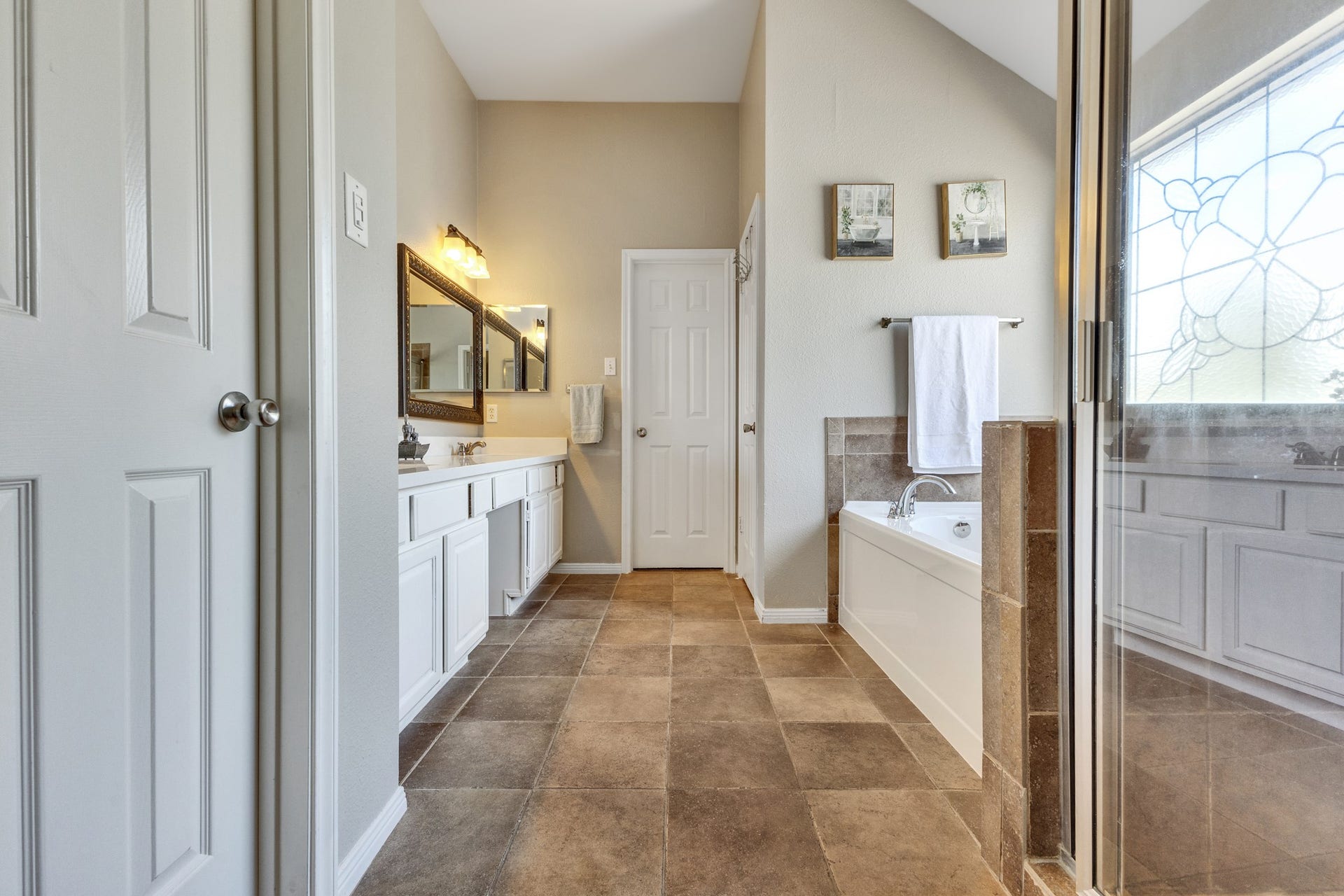 2922 Calendar Lake Drive, Missouri City, TX 77459 Primary bathroom features 2 separate walk in closets!! Schedule a tour to get a peek inside!
