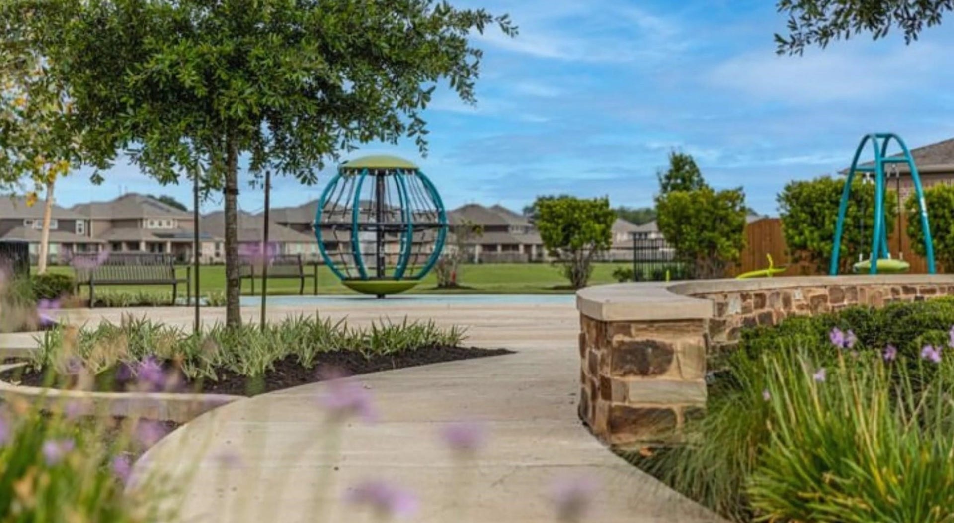 Charming community park featuring a modern playground, lush greenery, and scenic walkways, perfect for family enjoyment and outdoor relaxation.