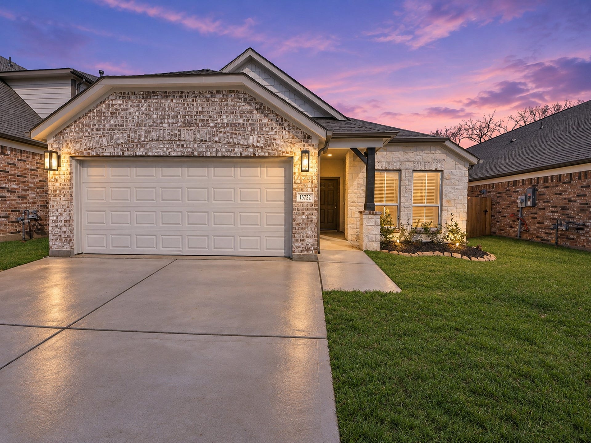 Experience the charm of this beautifully illuminated home, showcasing its inviting front elevation against a serene virtual twilight backdrop.