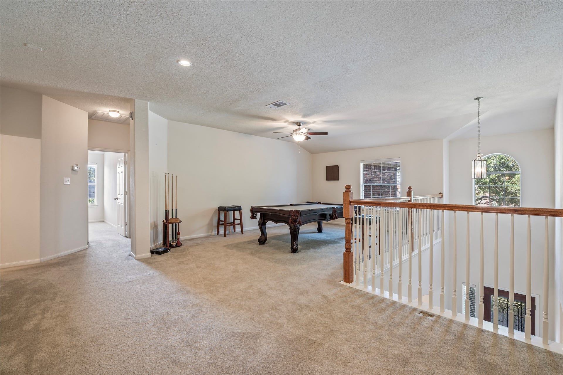 4404 Cypress Meadows Court, Dickinson, TX 77539 The second-floor landing opens to a huge game room, a great extra living space.