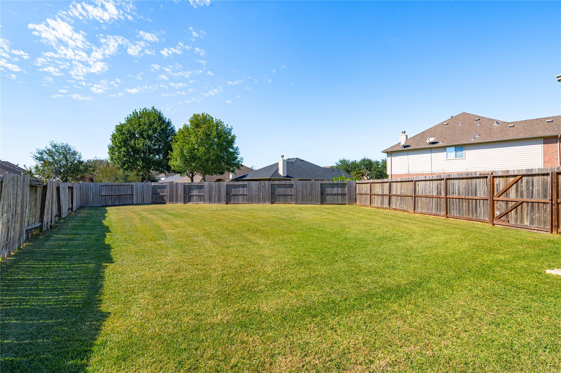 4404 Cypress Meadows Court, Dickinson, TX 77539 A huge backyard with privacy fencing on all sides, plenty of room for play, pets, gardening or a future pool.