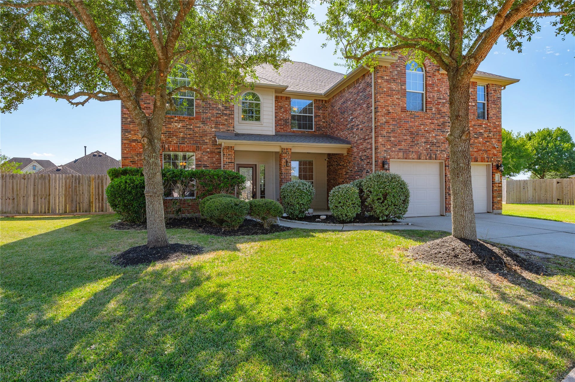 4404 Cypress Meadows Court, Dickinson, TX 77539 A wide, deep front yard sets the home back from the street for extra privacy and a striking first impression.