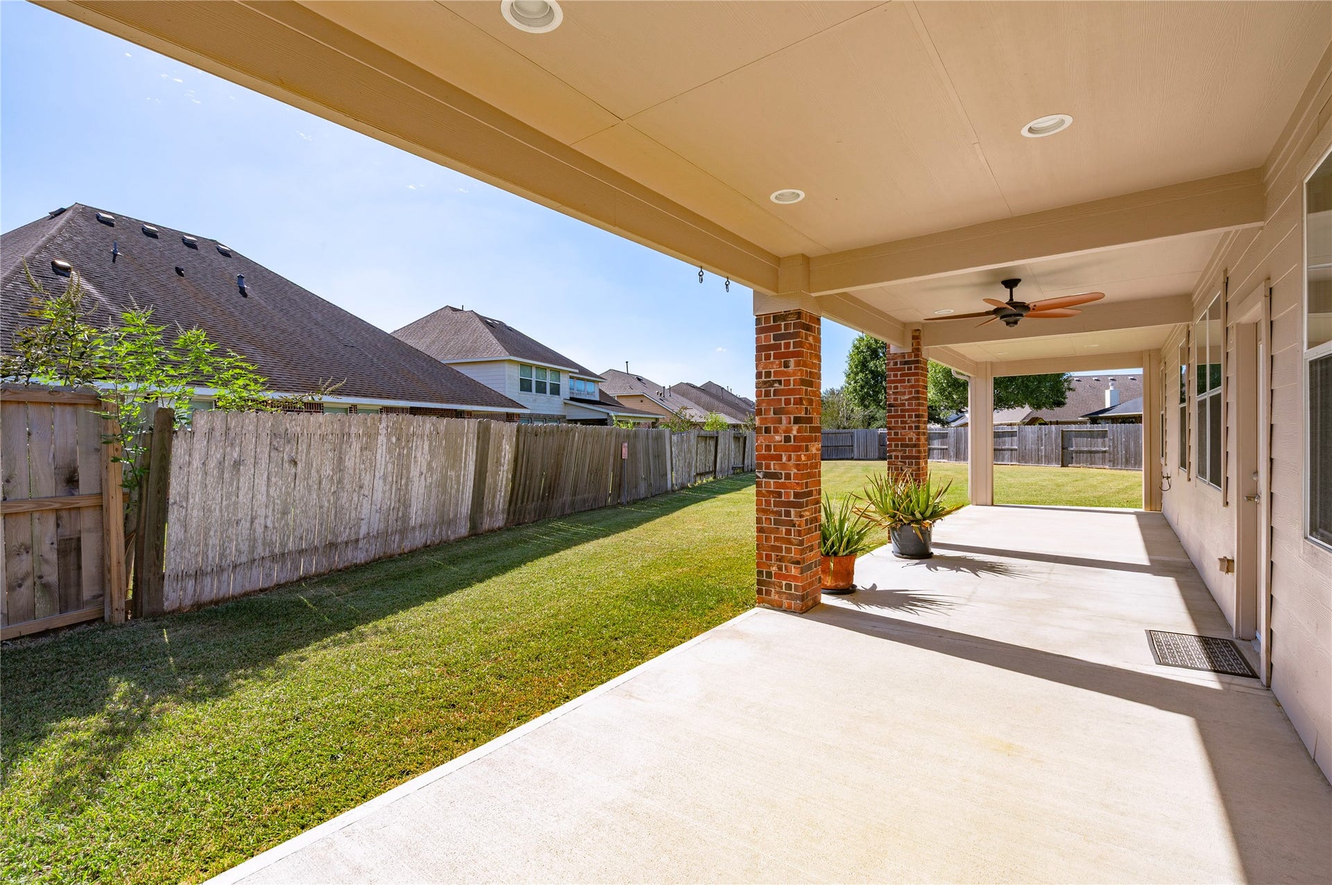 4404 Cypress Meadows Court, Dickinson, TX 77539 The covered patio overlooks the large backyard, an easy spot to keep an eye on outdoor activities.