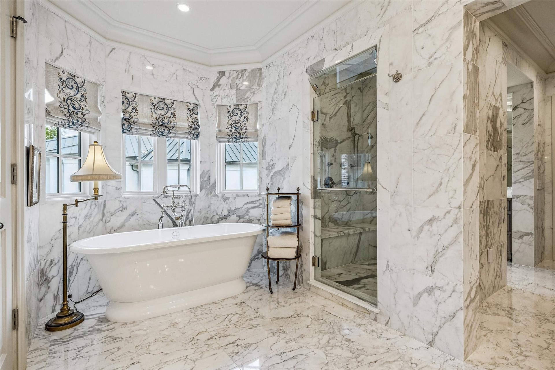 2158 Chilton Road, Houston, TX 77019 Designed for luxury, the primary baths luxury features are a steam shower, soaking tub, and abundant storage in vanities and cabinetry. Marble wainscoting and designer wallpaper complete this serene retreat.