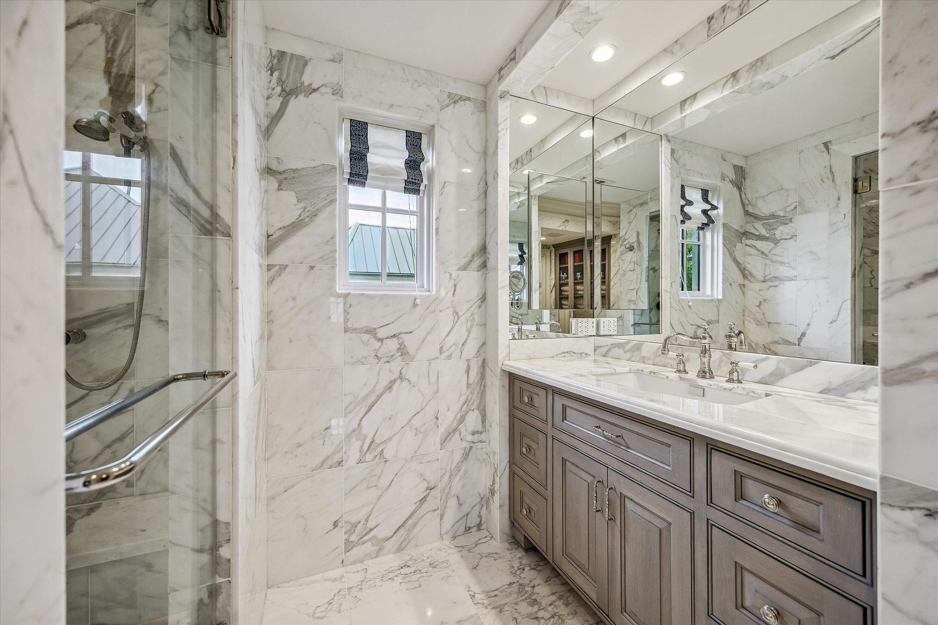 2158 Chilton Road, Houston, TX 77019 The primary bathroom is a spa-inspired sanctuary with marble heated floors, a soaking tub, and a steam shower with dual shower heads and body jets. Dual vanities and designer lighting create both beauty and functionality.