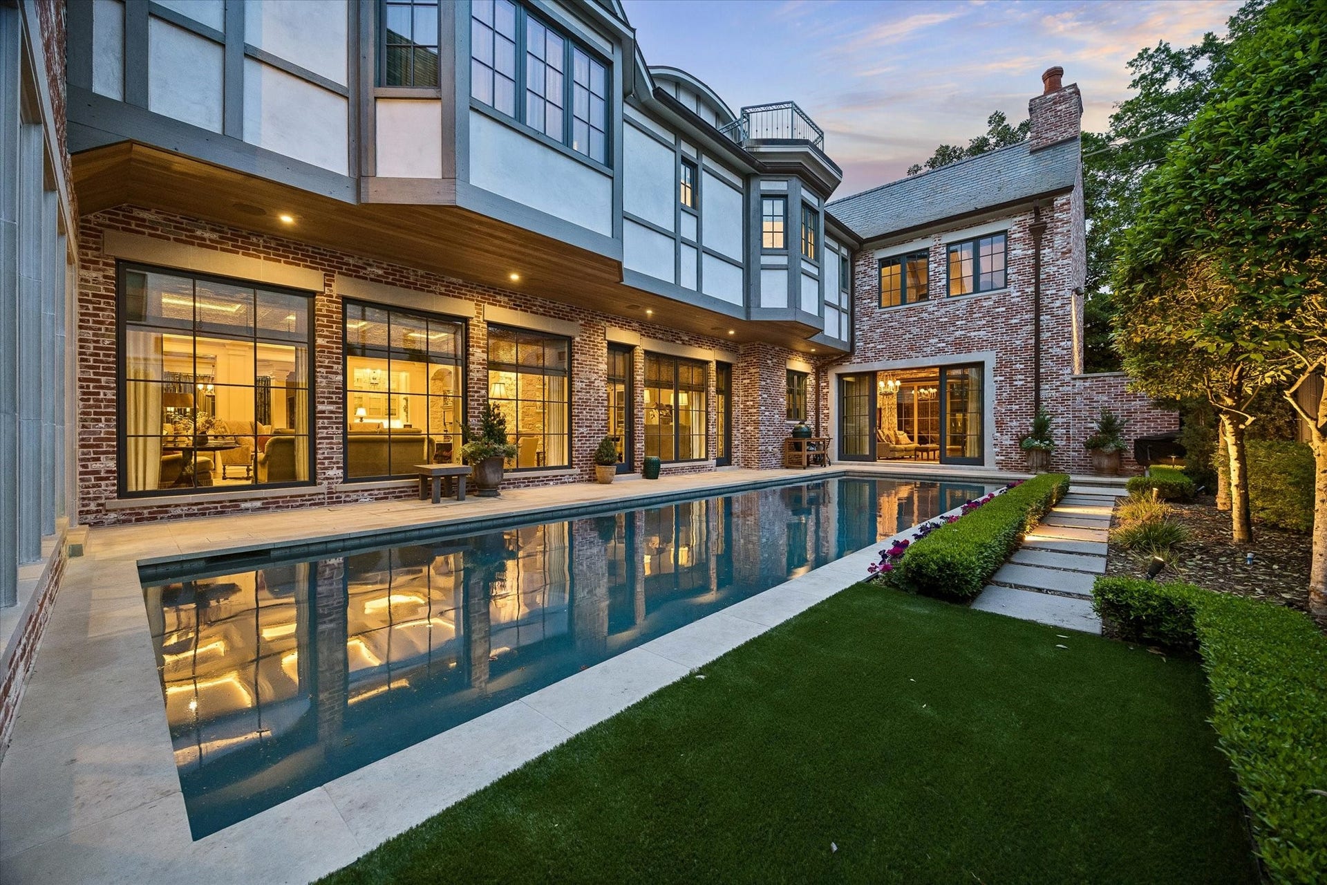 2158 Chilton Road, Houston, TX 77019 Designed for relaxation and entertaining, the backyard features a heated pool and spa, sprinkler system, and pet hydration station. Elegant touches like landscape lighting and a 30kW generator provide convenience and luxury.